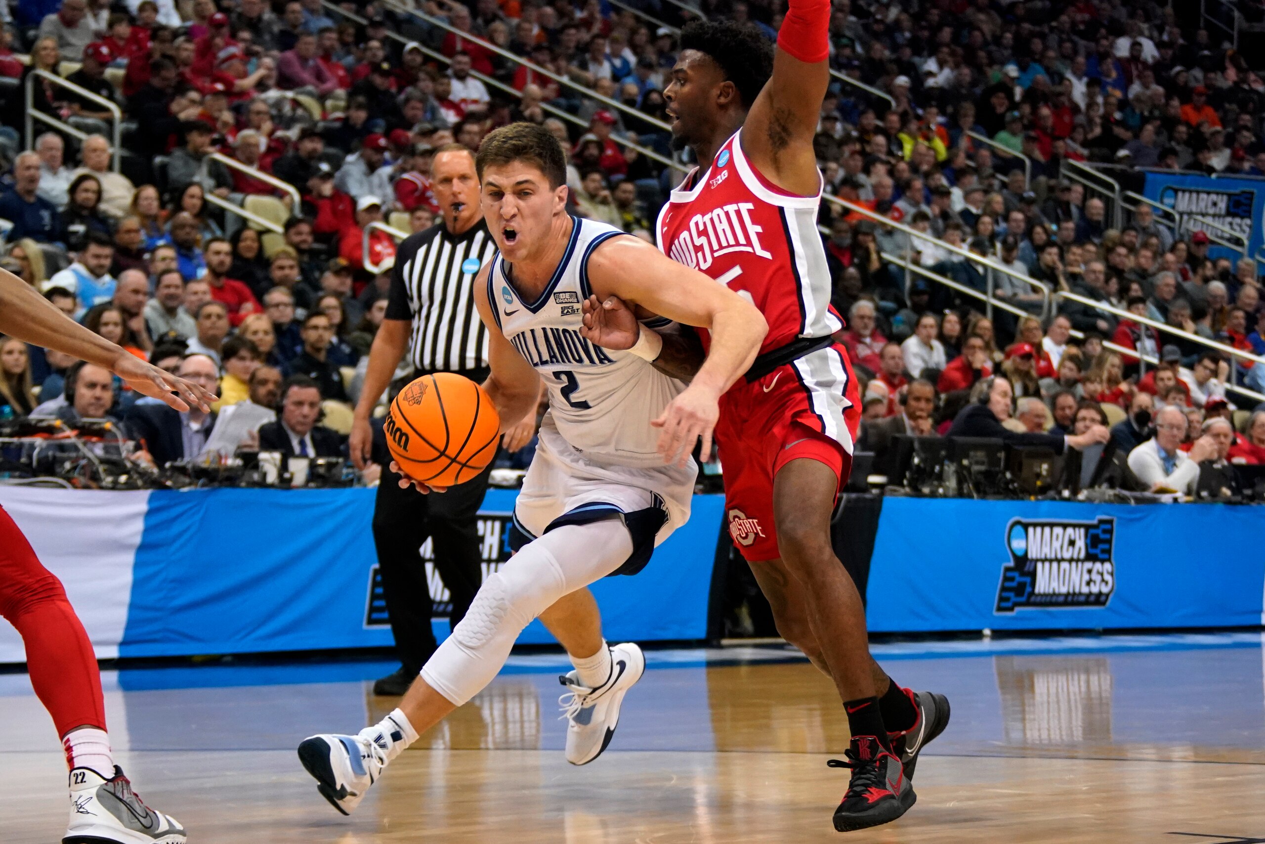 Villanova's Collin Gillespie (2) works to get around Ohio State 's Jamari Wheeler (55) during the first half of a college basketball game in the second round of the NCAA tournament in Pittsburgh, Sunday, March 20, 2022. (AP Photo/Gene J. Puskar) Villanova's Collin Gillespie (2) works to get around Ohio State 's Jamari Wheeler (55) during the first half of a college basketball game in the second round of the NCAA tournament in Pittsburgh, Sunday, March 20, 2022. (AP Photo/Gene J. Puskar)