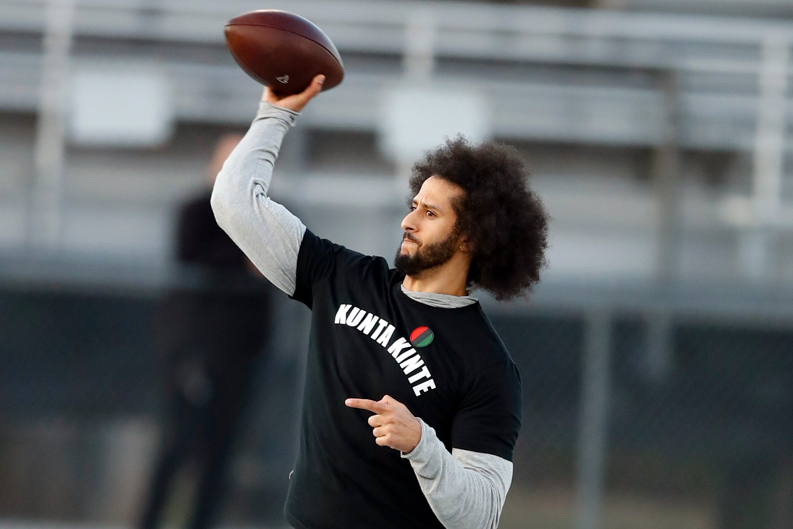 FILE - In this Nov. 16, 2019, file photo, free agent quarterback Colin Kaepernick participates in a workout for NFL football scouts and media in Riverdale, Ga. Kaepernick was a second-round draft pick in 2011 who the next year led the San Francisco 49ers to the Super Bowl. By 2016, he had begun kneeling on the sideline at games during the national anthem to protest social injustice and police brutality. Soon after, he was gone from the NFL, and he has not played since. (AP Photo/Todd Kirkland, File) FILE - In this Nov. 16, 2019, file photo, free agent quarterback Colin Kaepernick participates in a workout for NFL football scouts and media in Riverdale, Ga. Kaepernick was a second-round draft pick in 2011 who the next year led the San Francisco 49ers to the Super Bowl. By 2016, he had begun kneeling on the sideline at games during the national anthem to protest social injustice and police brutality. Soon after, he was gone from the NFL, and he has not played since. (AP Photo/Todd Kirkland, File)