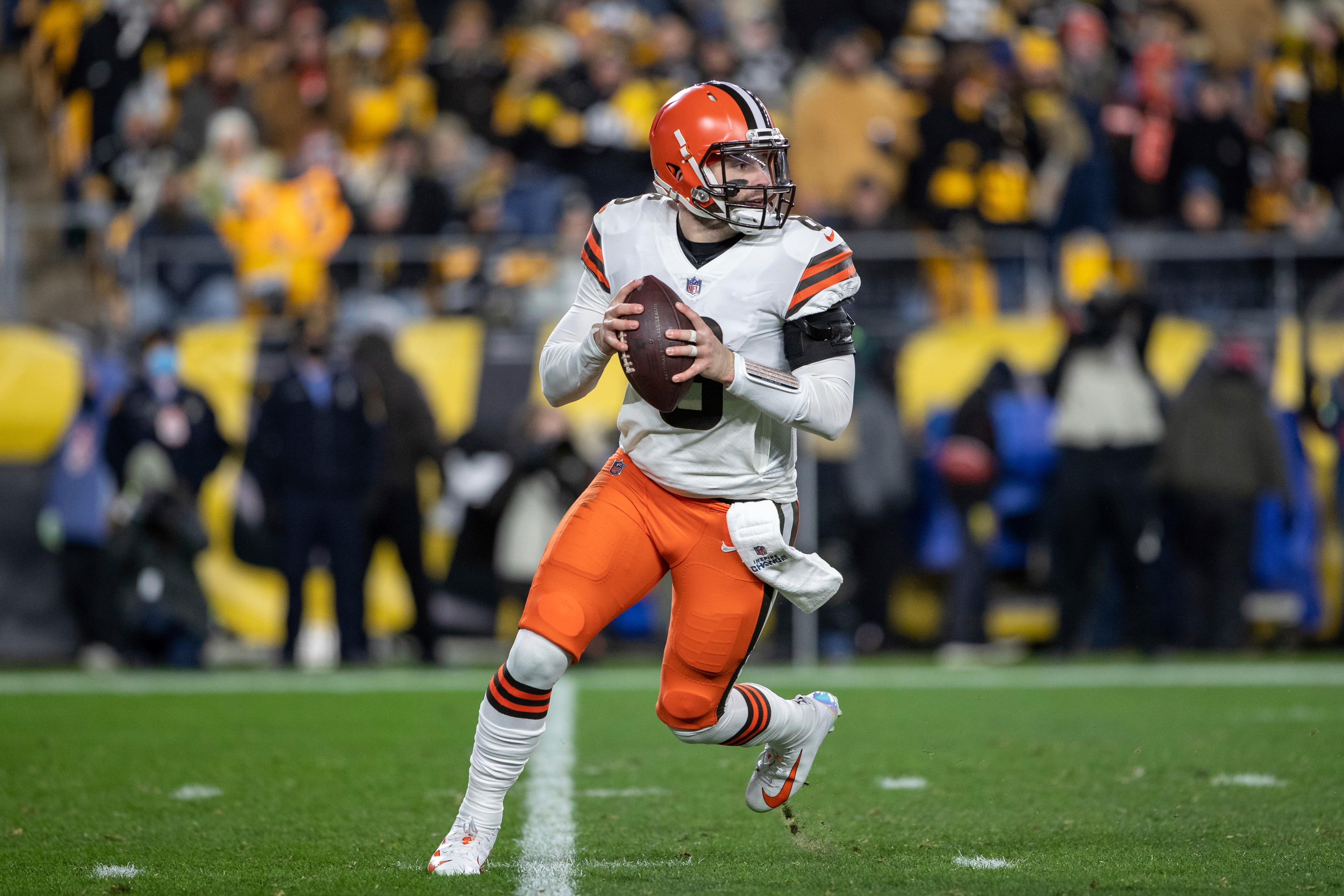 Cleveland Browns quarterback Baker Mayfield (6) rolls out of the pocket during an NFL football game, Monday, January 3, 2022 in Pittsburgh. (AP Photo/Matt Durisko)