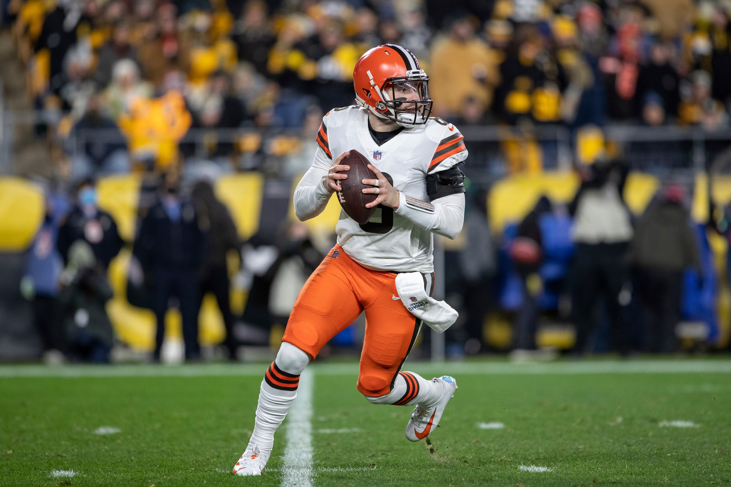 Cleveland Browns quarterback Baker Mayfield (6) rolls out of the pocket during an NFL football game, Monday, January 3, 2022 in Pittsburgh. (AP Photo/Matt Durisko)