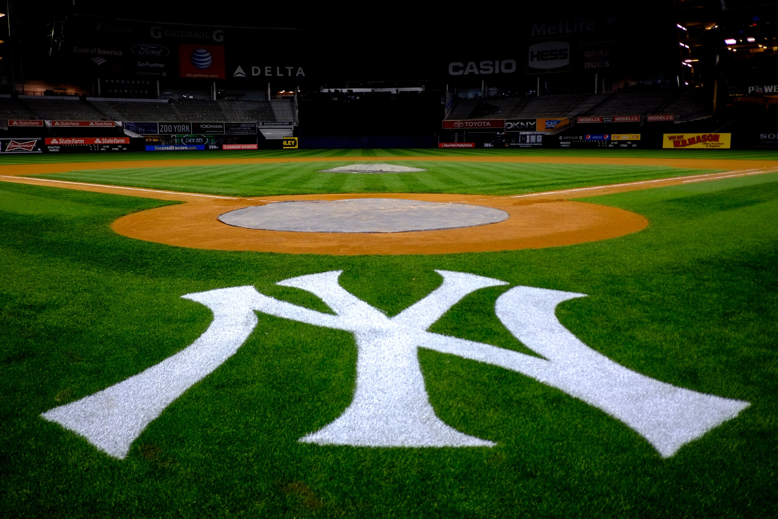 The New York Yankees logo is seen behind home plate at Yankee Stadium in New York following a baseball game against the Oakland Athletics, Friday, May 3, 2013. The Athletics won 2-0. (AP Photo/Julio Cortez)