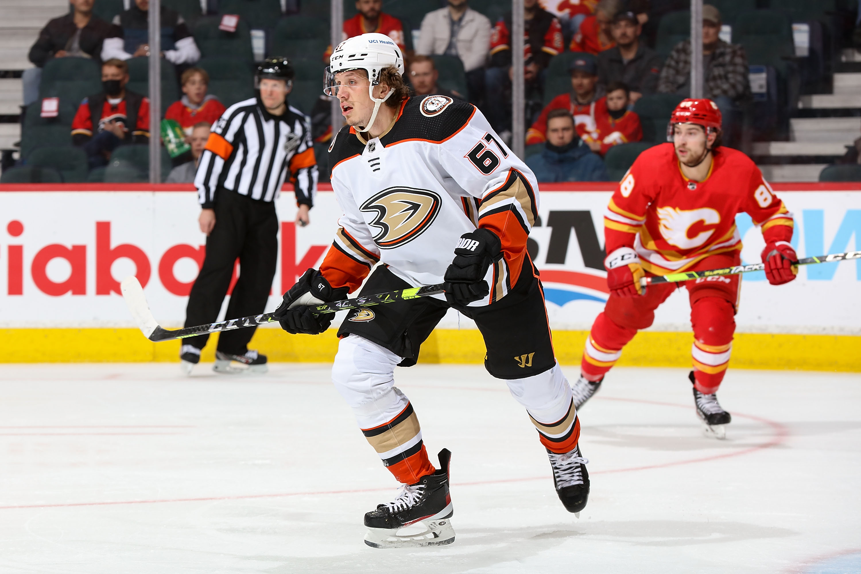 CALGARY, AB - FEBRUARY 16: Rickard Rakell #67 of the Anaheim Ducks skates up ice against the Calgary Flames at Scotiabank Saddledome on February 16, 2022 in Calgary, Alberta, Canada. (Photo by Gerry Thomas/NHLI via Getty Images)
