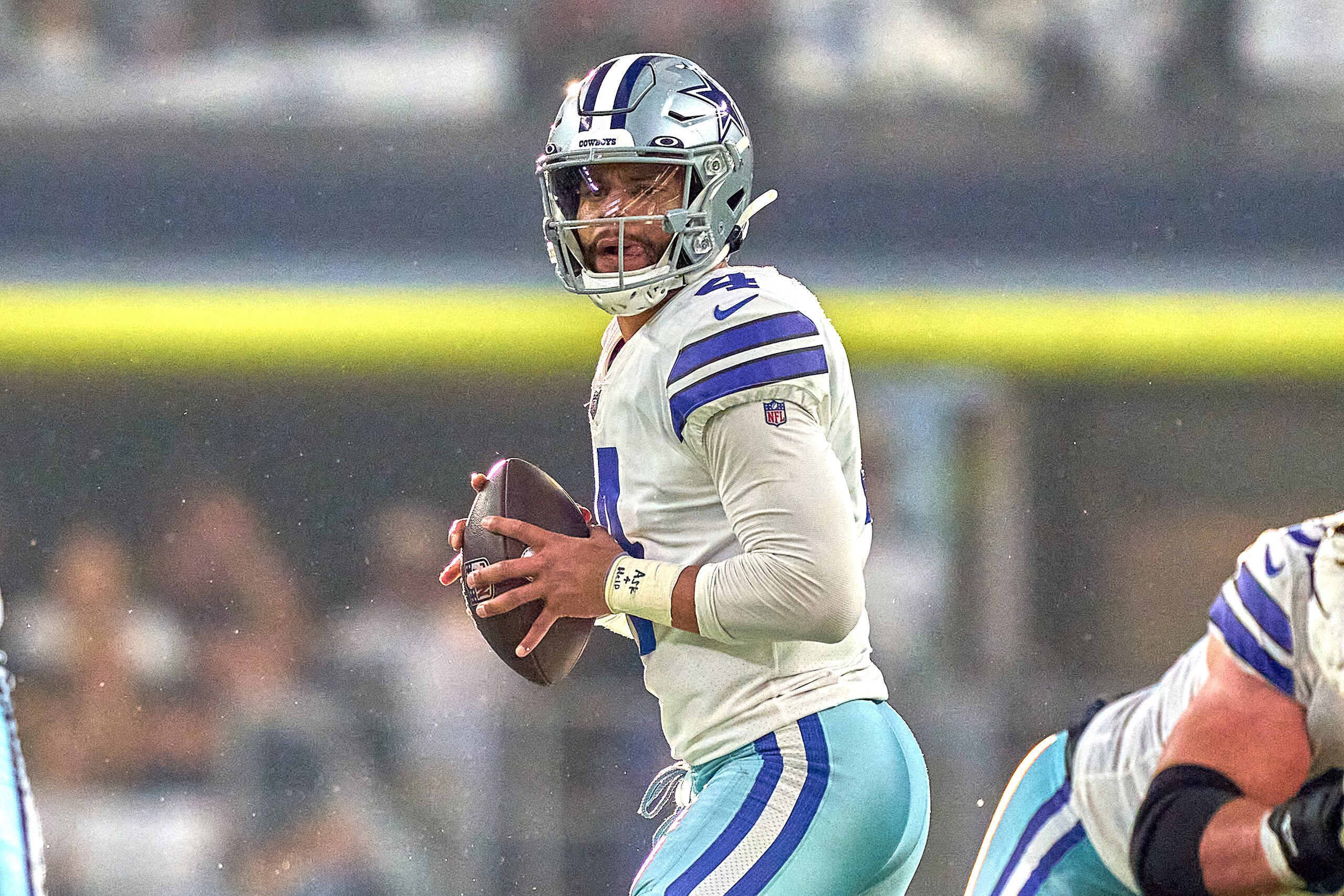 ARLINGTON, TX - JANUARY 16: Dallas Cowboys quarterback Dak Prescott (4) handles the football during the NFC Wild Card game between the San Francisco 49ers and the Dallas Cowboys on January 16, 2022 at AT&T Stadium in Arlington, TX. (Photo by Robin Alam/Icon Sportswire via Getty Images)