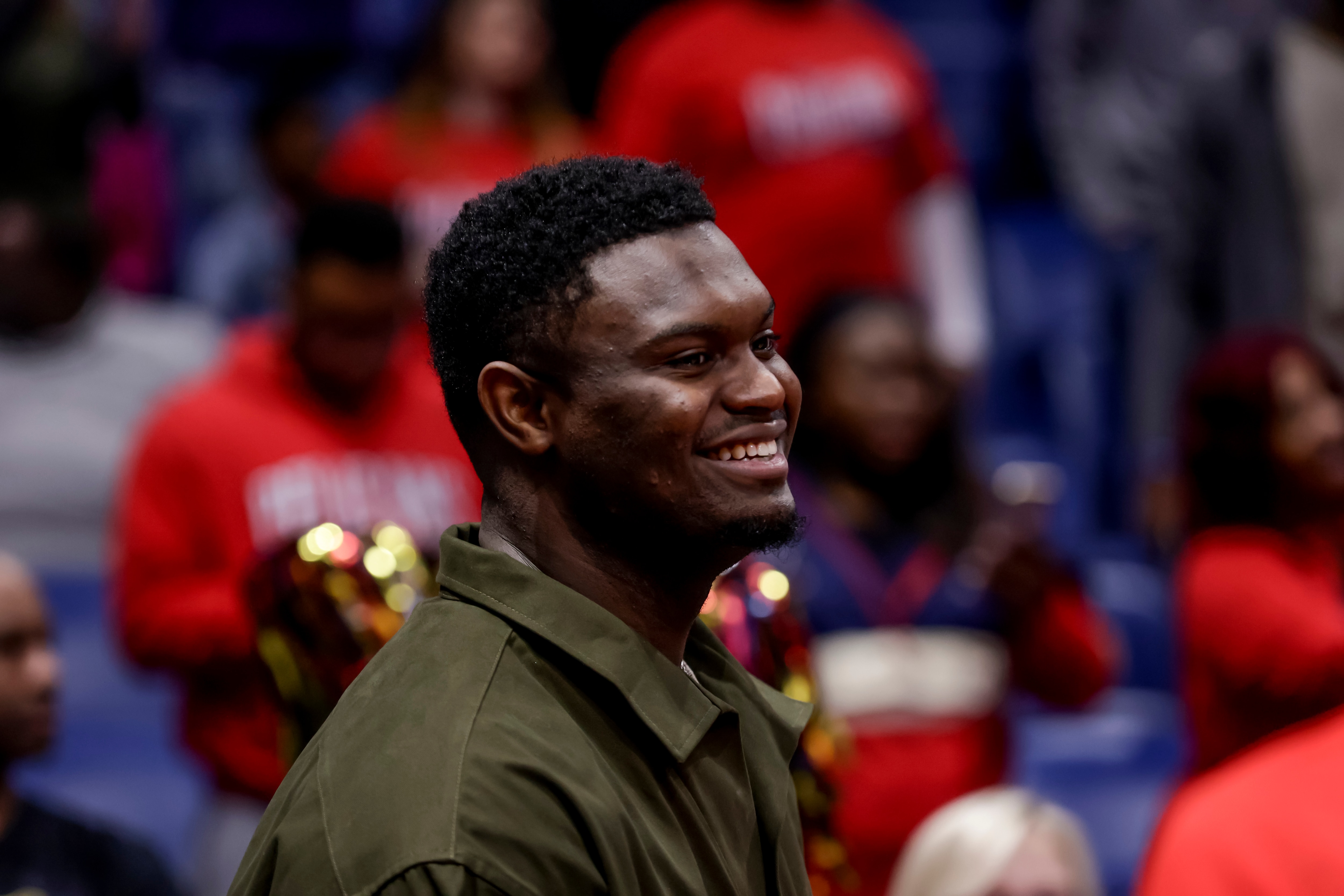 New Orleans Pelicans forward Zion Williamson smiles before the team's NBA basketball game against the Charlotte Hornets in New Orleans, Friday, March 11, 2022. (AP Photo/Derick Hingle)