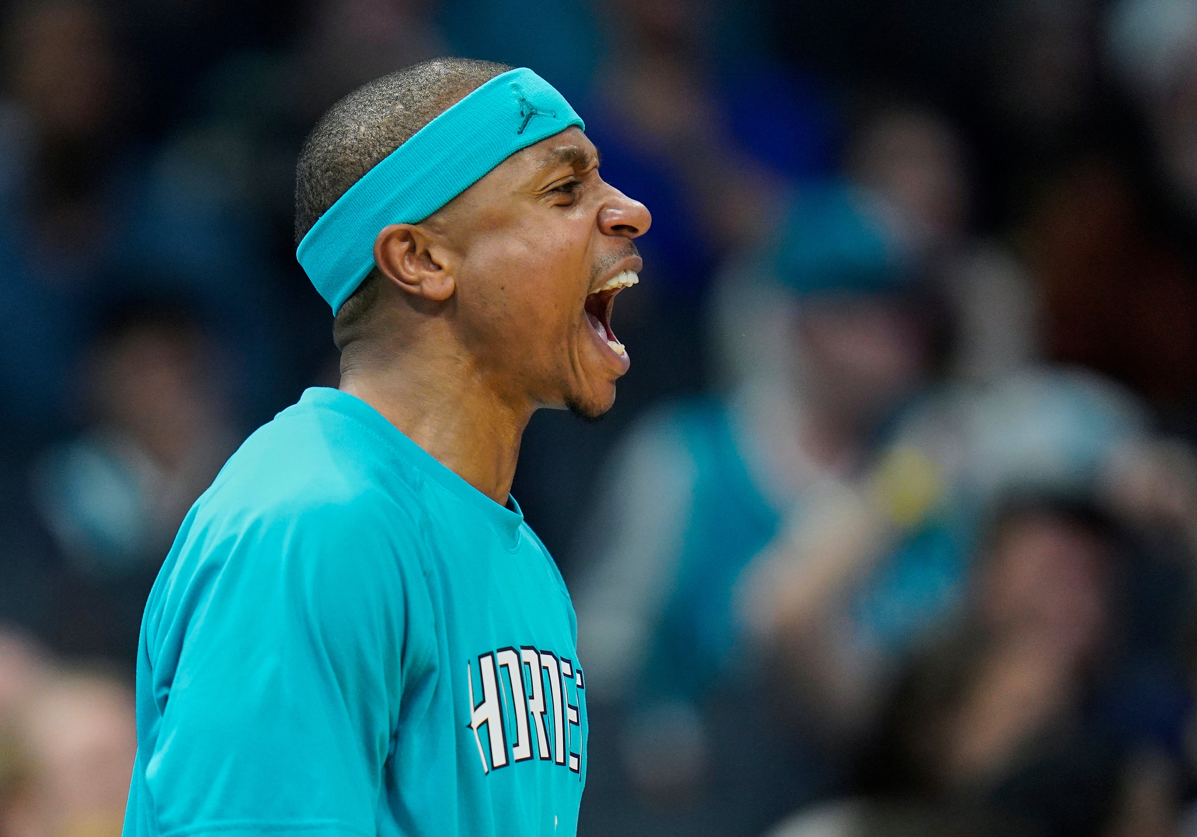 Charlotte Hornets guard Isaiah Thomas cheers on his team during the second half of an NBA basketball game against the New Orleans Pelicans on Monday, March 21, 2022, in Charlotte, N.C. (AP Photo/Rusty Jones)