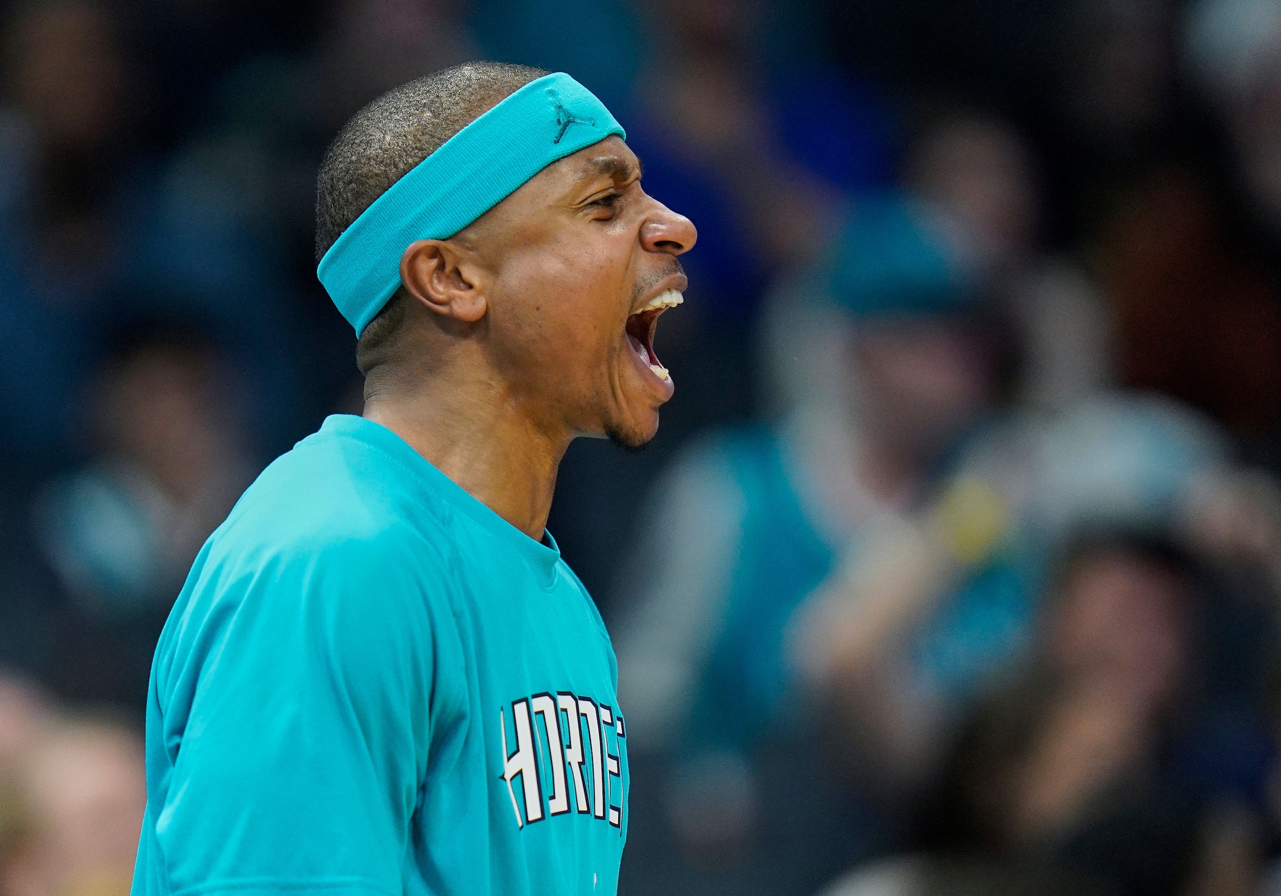 Charlotte Hornets guard Isaiah Thomas cheers on his team during the second half of an NBA basketball game against the New Orleans Pelicans on Monday, March 21, 2022, in Charlotte, N.C. (AP Photo/Rusty Jones)