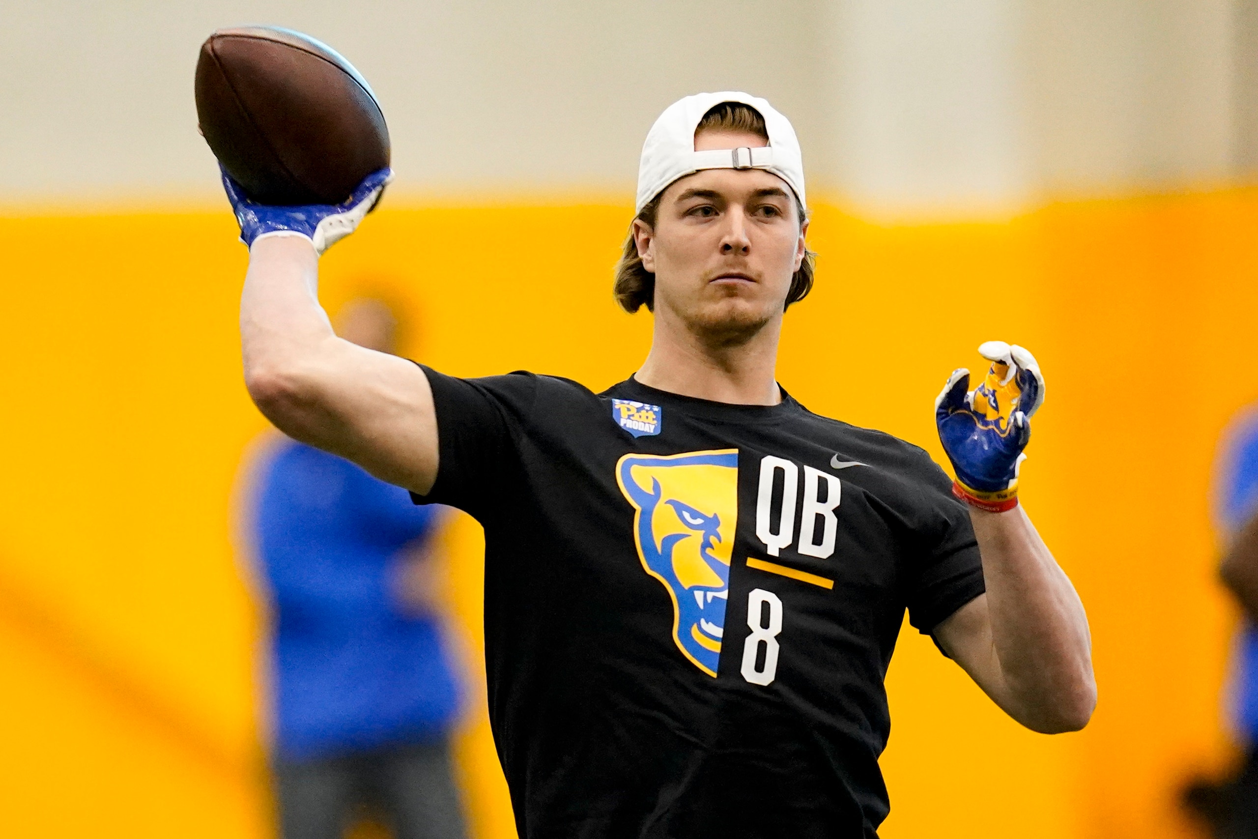Quarterback Kenny Pickett (8) goes through passing drills during Pittsburgh's football pro day , Monday, March 21, 2022, in Pittsburgh. (AP Photo/Keith Srakocic)