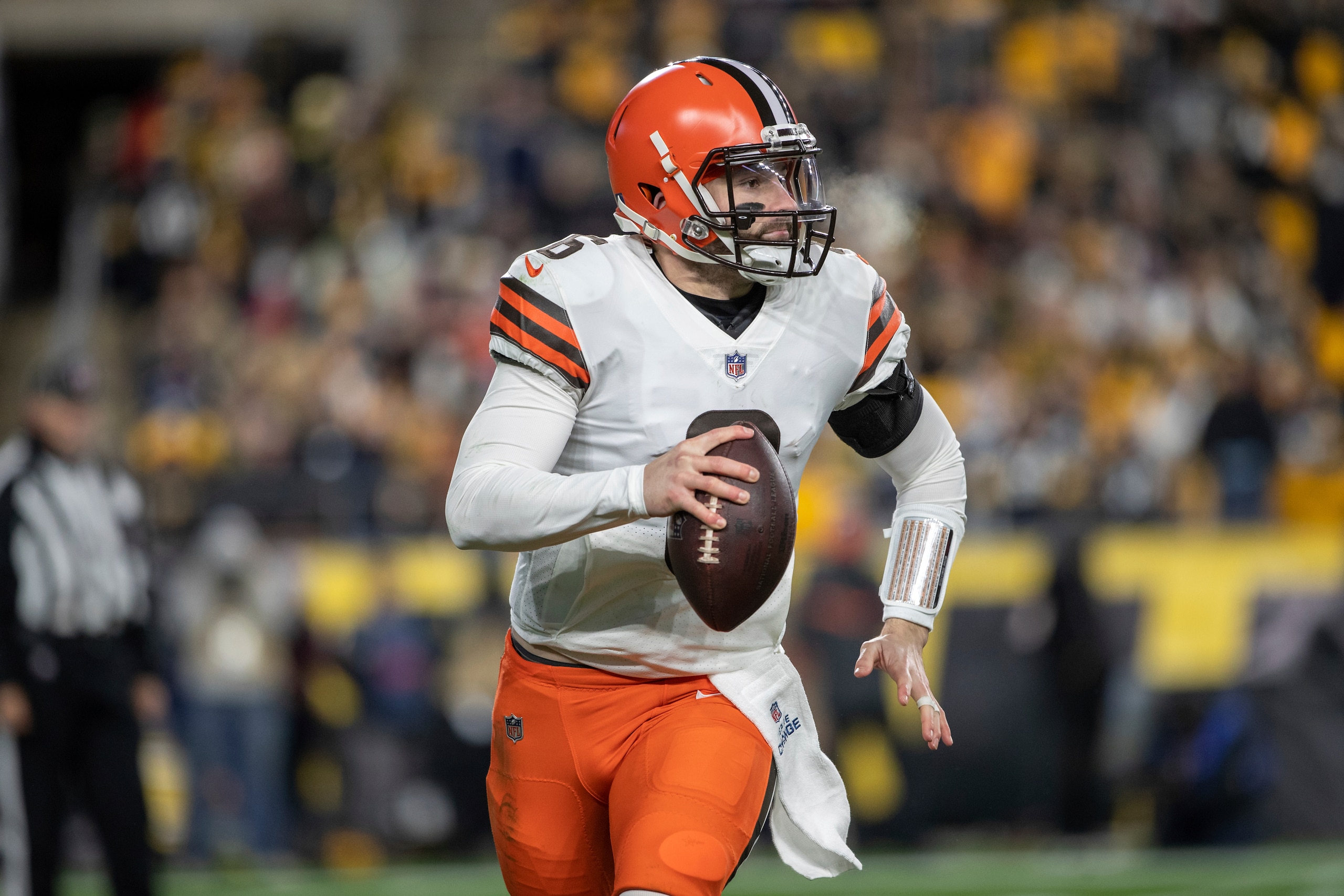Cleveland Browns quarterback Baker Mayfield (6) rolls out of the pocket during an NFL football game, Monday, January 3, 2022 in Pittsburgh. (AP Photo/Matt Durisko)