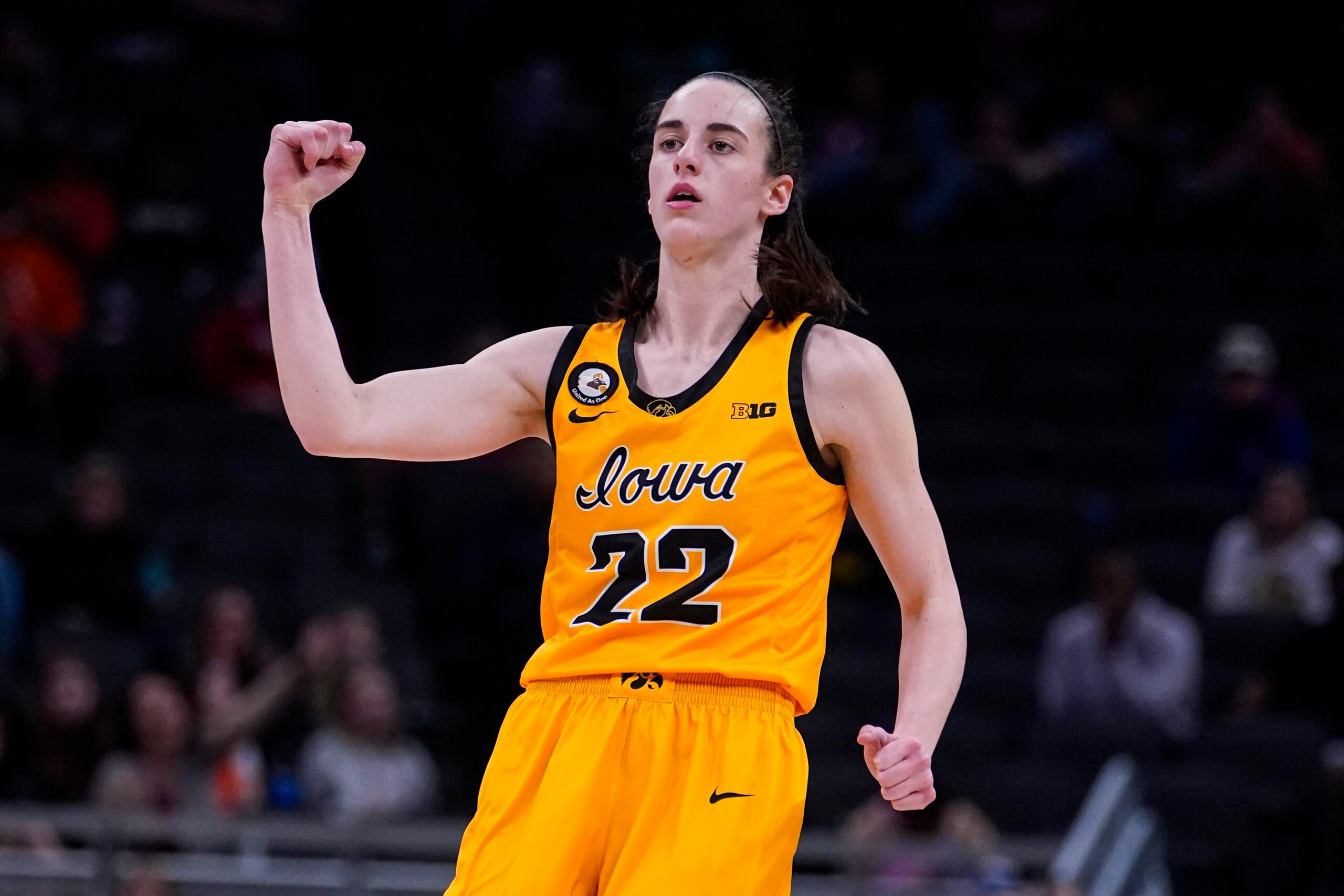 Iowa guard Caitlin Clark (22) celebrates a 3e-point basket against Nebraska in the second half of an NCAA college basketball game at the Big Ten Conference tournament in Indianapolis, Saturday, March 5, 2022. (AP Photo/Michael Conroy)
