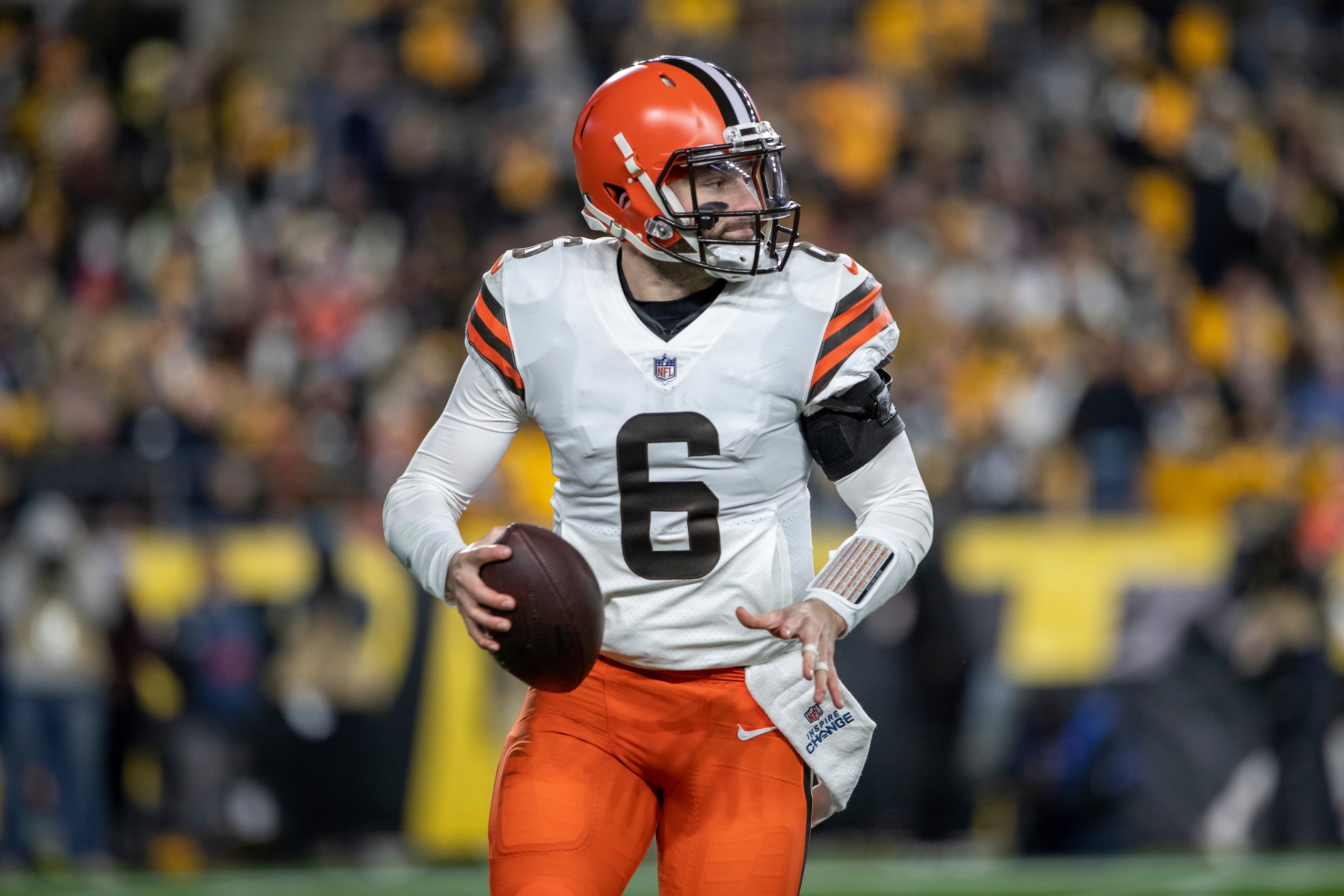 Cleveland Browns quarterback Baker Mayfield (6) rolls out of the pocket during an NFL football game, Monday, January 3, 2022 in Pittsburgh. (AP Photo/Matt Durisko)