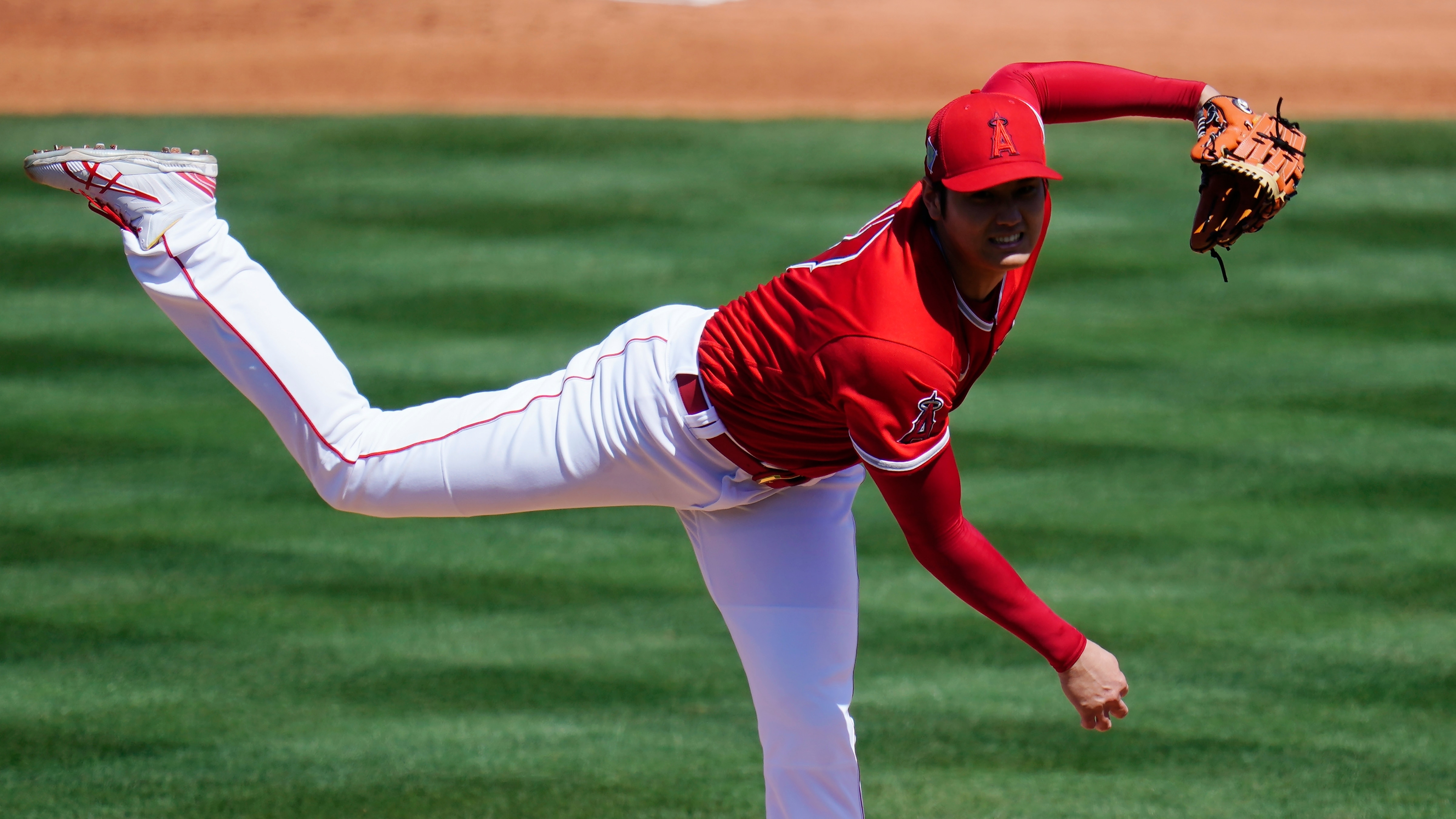Los Angeles Angels pitcher Shohei Ohtani, of Japan, throws a pitch against the Kansas City Royals during the second inning of a spring training baseball game Monday, March 21, 2022, in Tempe, Ariz. (AP Photo/Ross D. Franklin)