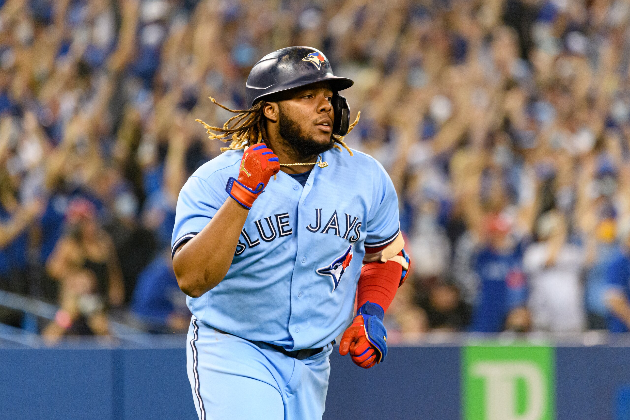 TORONTO, ON - OCTOBER 03: Toronto Blue Jays First base Vladimir Guerrero Jr. (27) celebrates his homerun during the MLB baseball regular season game between the Baltimore Orioles and the Toronto Blue Jays on October 3, 2021, at Rogers Centre in Toronto, ON, Canada. (Photo by Julian Avram/Icon Sportswire via Getty Images) TORONTO, ON - OCTOBER 03: Toronto Blue Jays First base Vladimir Guerrero Jr. (27) celebrates his homerun during the MLB baseball regular season game between the Baltimore Orioles and the Toronto Blue Jays on October 3, 2021, at Rogers Centre in Toronto, ON, Canada. (Photo by Julian Avram/Icon Sportswire via Getty Images)