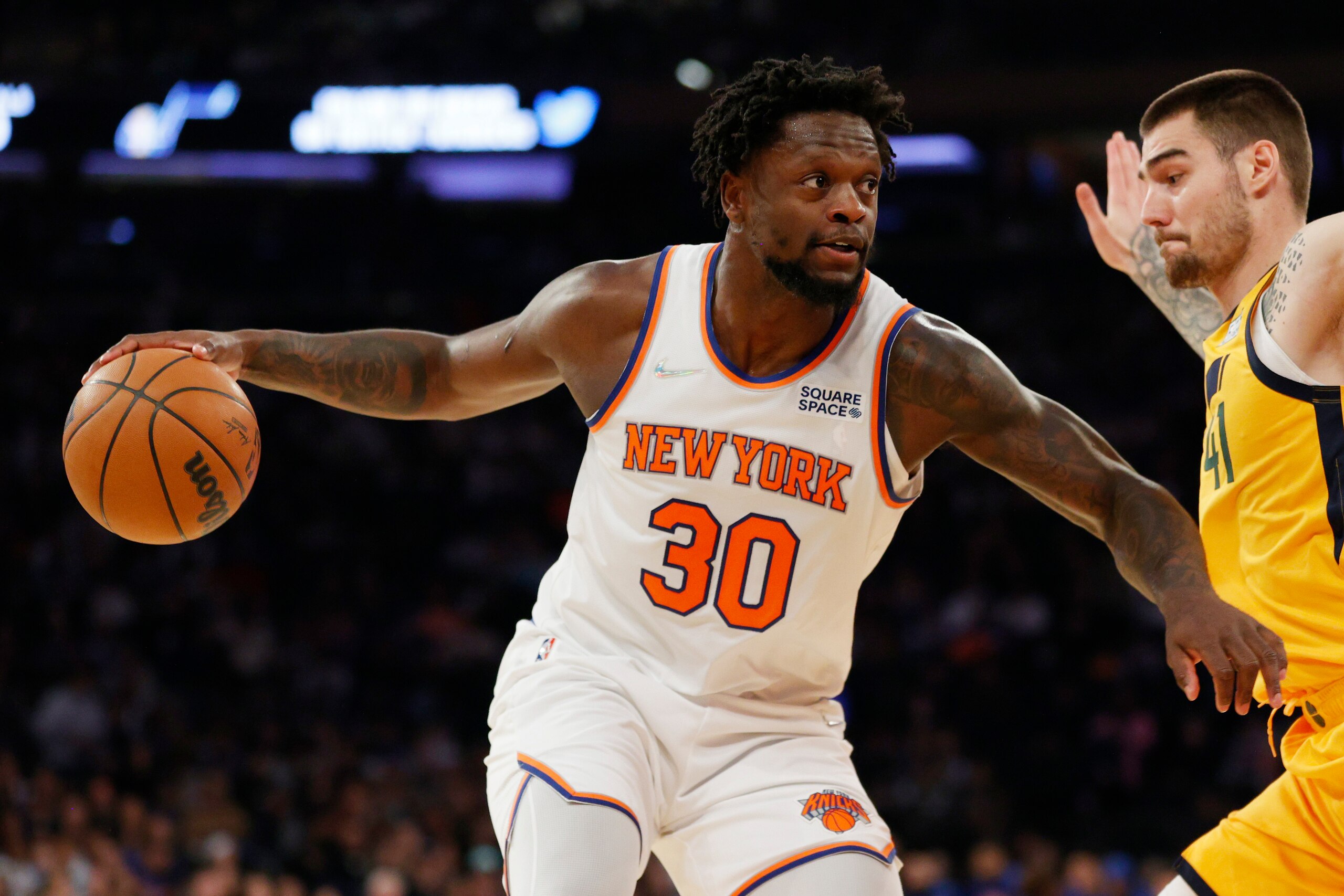 NEW YORK, NEW YORK - MARCH 20: Julius Randle #30 of the New York Knicks dribbles as Juancho Hernangomez #41 of the Utah Jazz defends during the first half at Madison Square Garden on March 20, 2022 in New York City. NOTE TO USER: User expressly acknowledges and agrees that, by downloading and or using this photograph, User is consenting to the terms and conditions of the Getty Images License Agreement. (Photo by Sarah Stier/Getty Images)