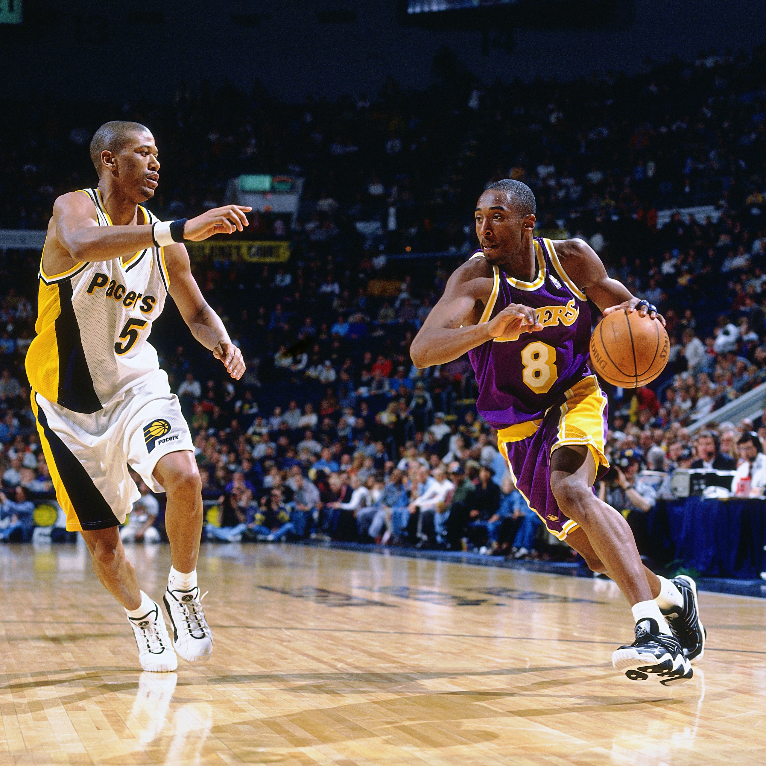 INDIANAPOLIS - MARCH 2: Kobe Bryant #8 of the Los Angeles Lakers dribbles  during a game played on March 2, 1997 at Market Square Garden in Indianapolis, Indiana. NOTE TO USER: User expressly acknowledges and agrees that, by downloading and/or using this photograph, user is consenting to the terms and conditions of the Getty Images License Agreement.  Mandatory Copyright Notice: Copyright 1997 NBAE (Photo by Nathaniel S. Butler/NBAE via Getty Images)
