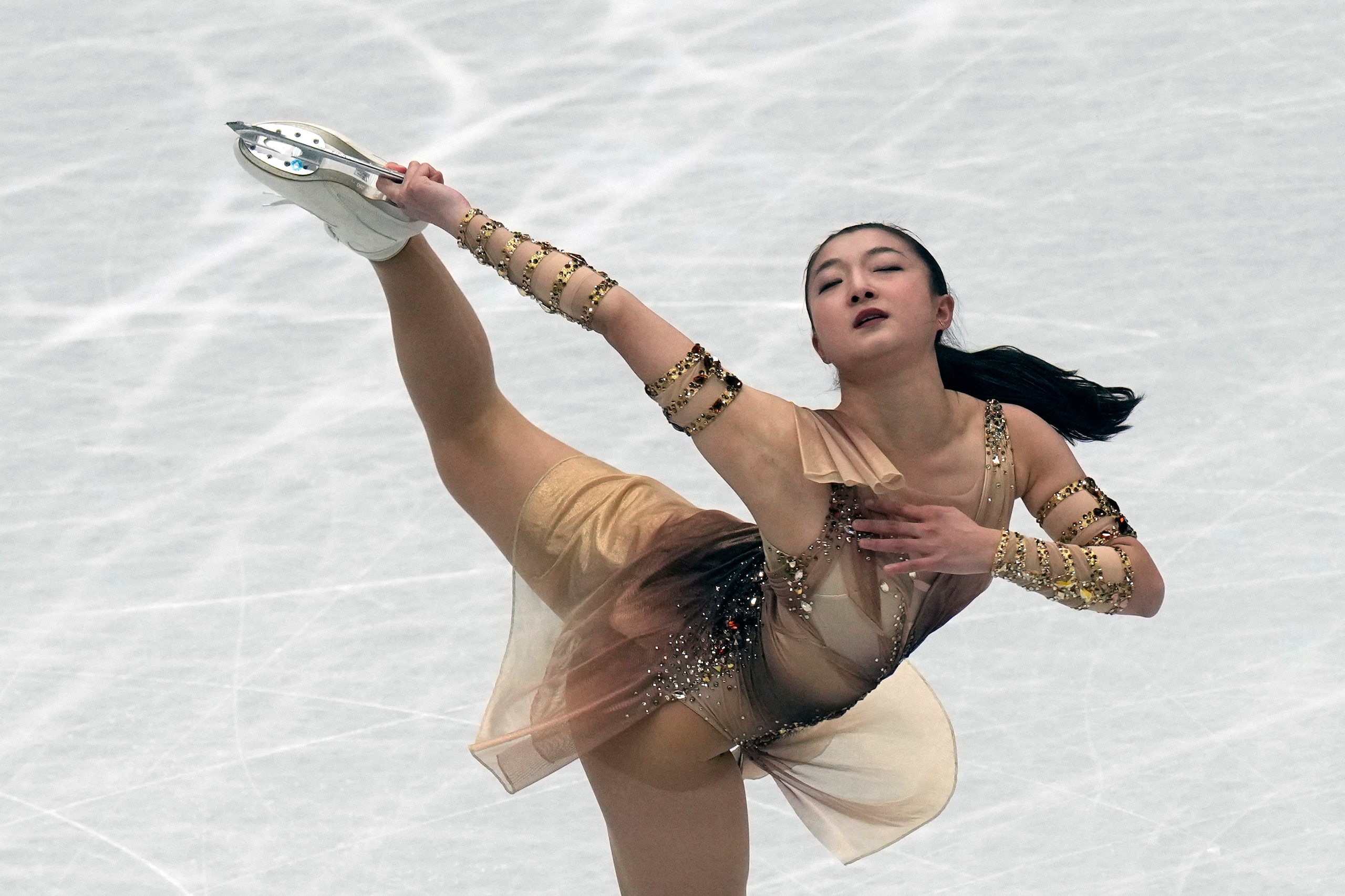 Kaori Sakamoto, of Japan, performs in the women short program at the Figure Skating World Championships in Montpellier, south of France, Wednesday, March 23, 2022. (AP Photo/Francisco Seco)