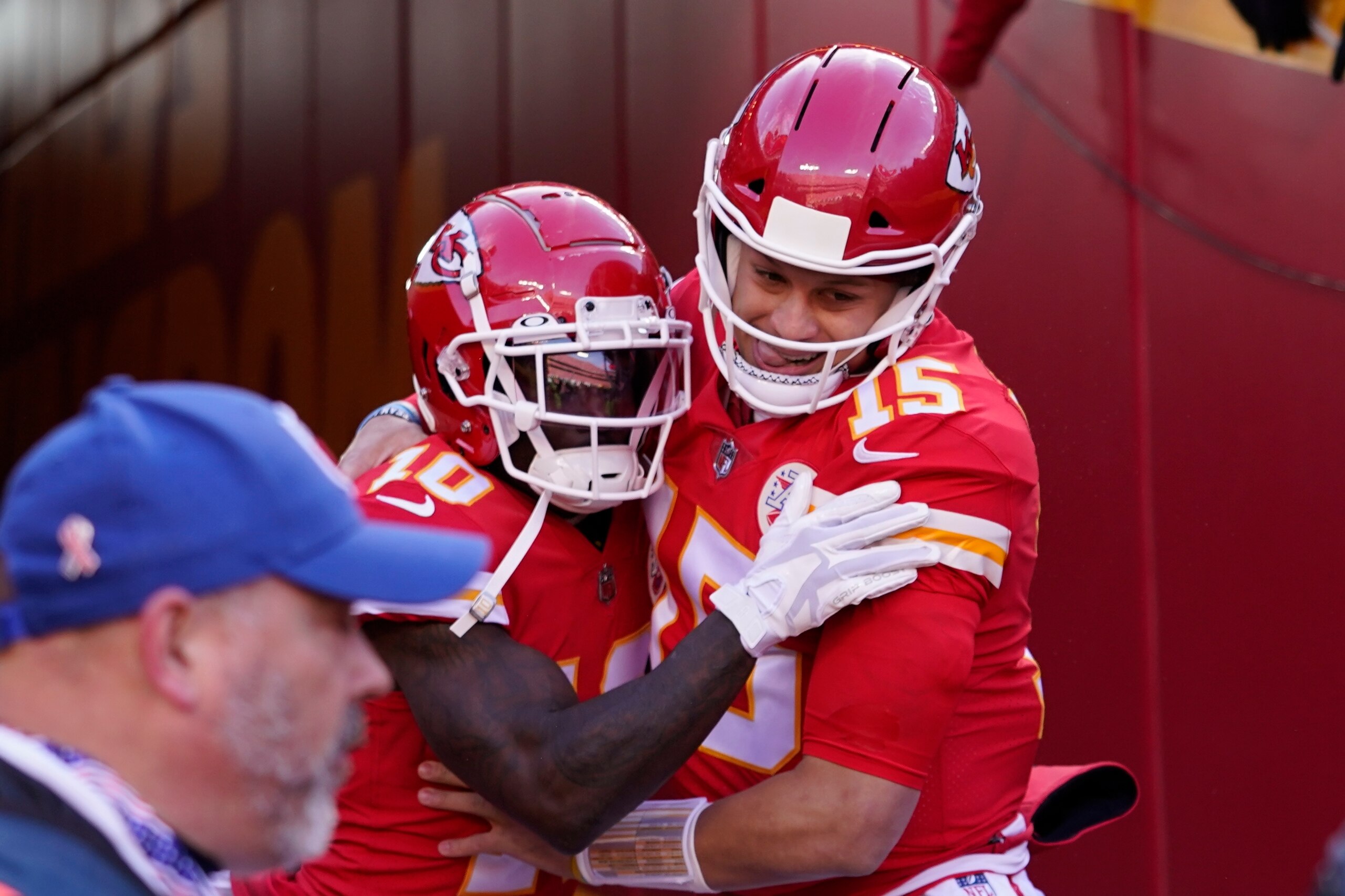 Kansas City Chiefs wide receiver Tyreek Hill (10) celebrates with teammate quarterback Patrick Mahomes (15) after catching a 10-yard touchdown pass during the first half of the AFC championship NFL football game against the Cincinnati Bengals, Sunday, Jan. 30, 2022, in Kansas City, Mo. (AP Photo/Ed Zurga)
