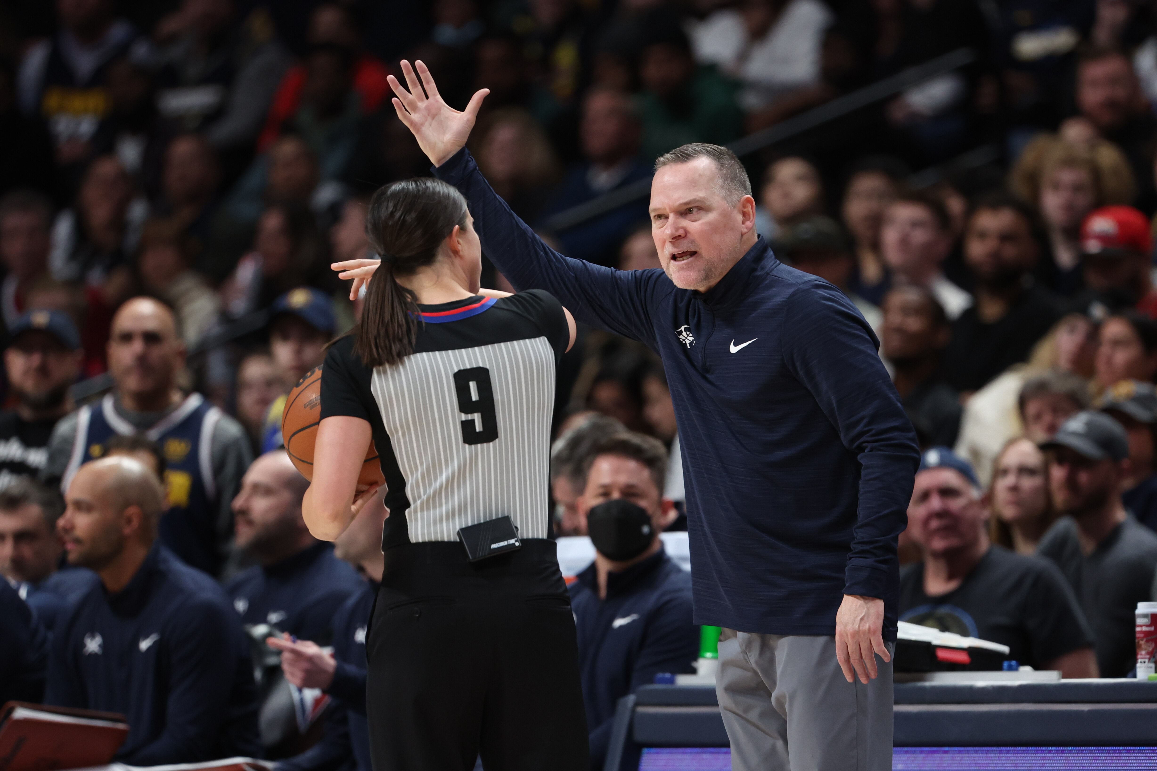 DENVER, CO - MARCH 22: Michael Malone head coach of the Denver Nuggets talks to referee Natalie Sago #9 while facing the Los Angeles Clippers at Ball Arena on March 22, 2022 in Denver, Colorado. NOTE TO USER: User expressly acknowledges and agrees that, by downloading and or using this photograph, User is consenting to the terms and conditions of the Getty Images License Agreement (Photo by Isaiah Vazquez/Clarkson Creative/Getty Images)