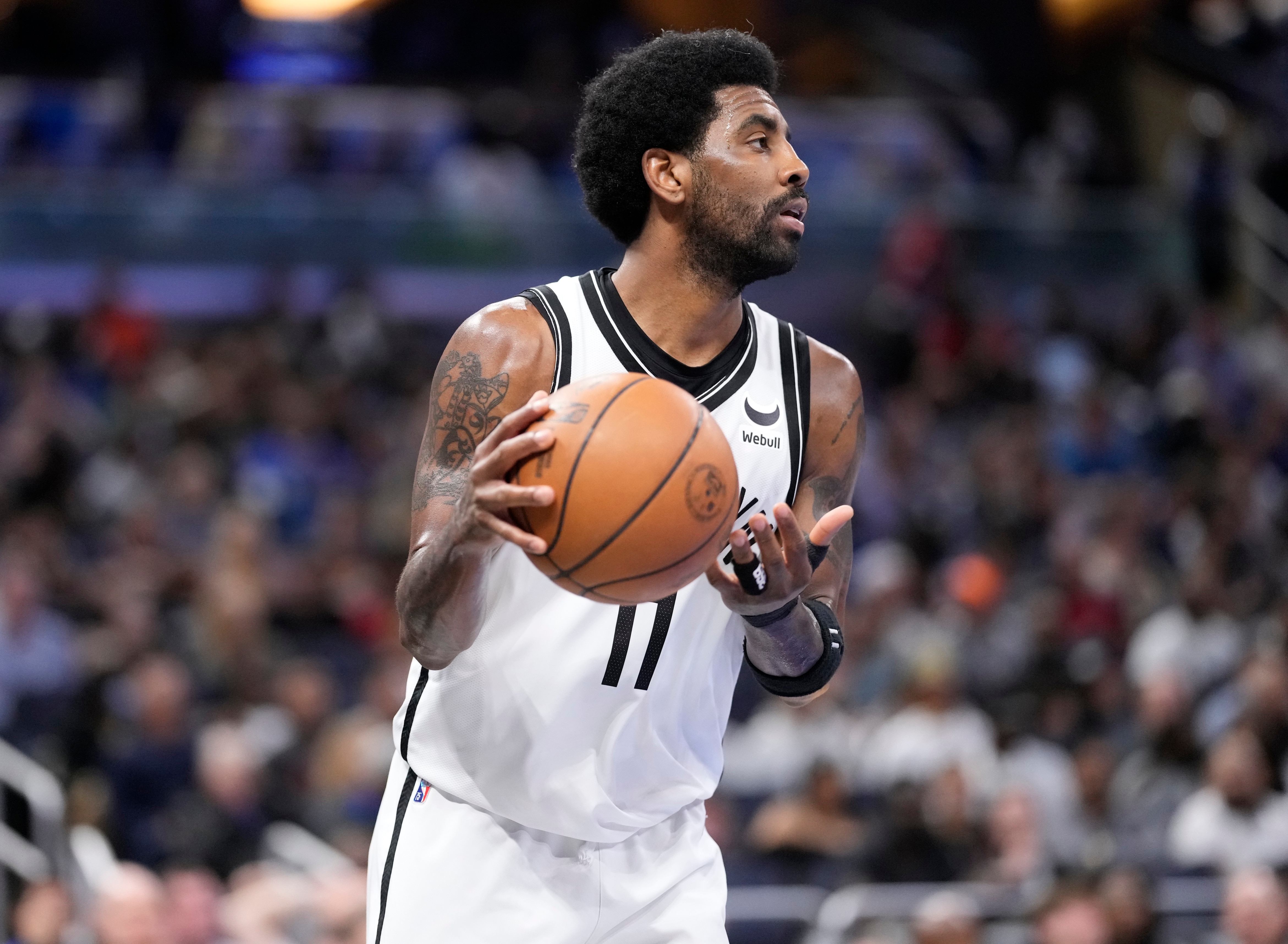 ORLANDO, FLORIDA - MARCH 15: Kyrie Irving #11 of the Brooklyn Nets controls the ball against the Orlando Magic at Amway Center on March 15, 2022 in Orlando, Florida. NOTE TO USER: User expressly acknowledges and agrees that, by downloading and or using this photograph, User is consenting to the terms and conditions of the Getty Images License Agreement. (Photo by Mark Brown/Getty Images)