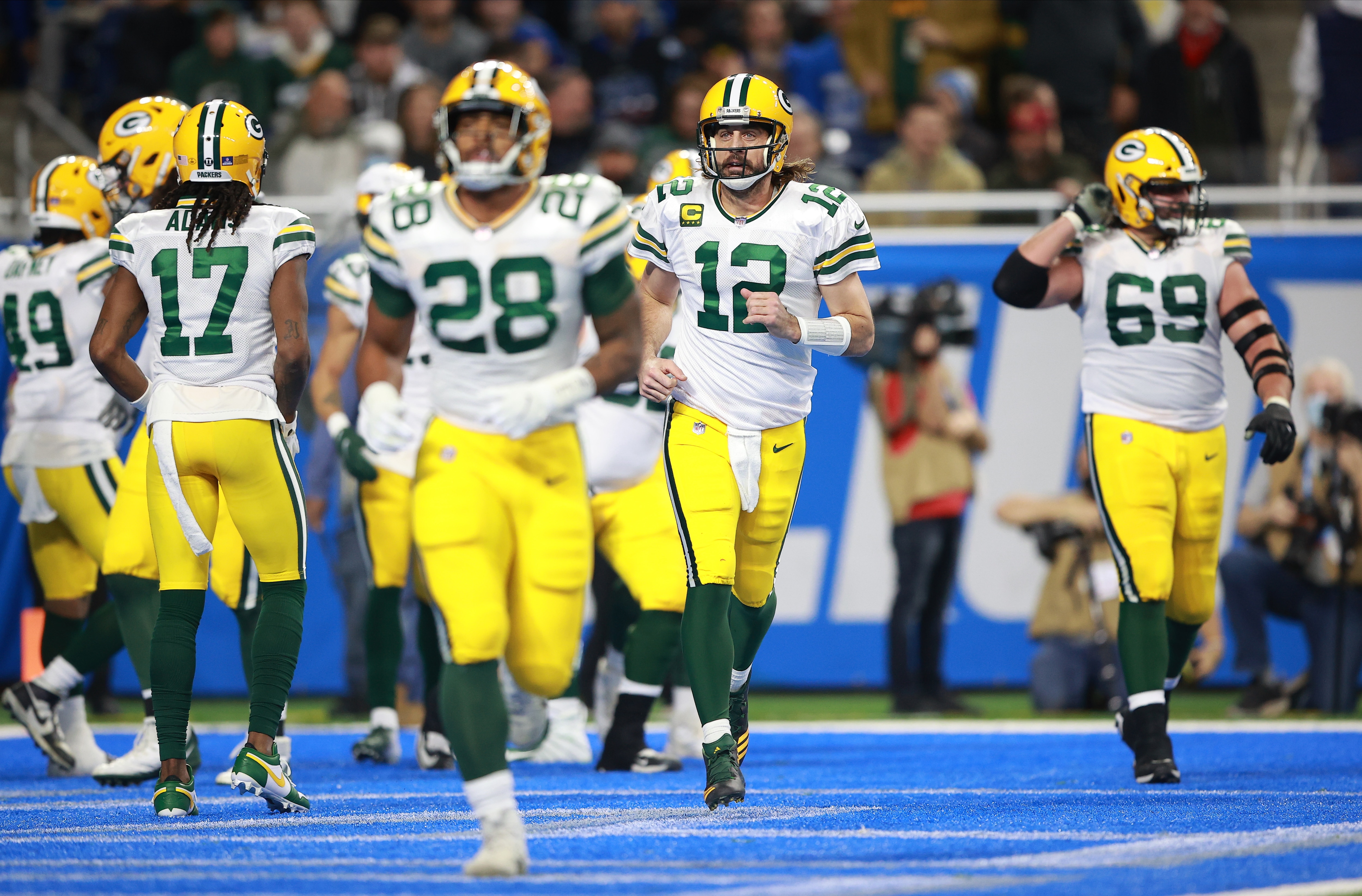 DETROIT, MICHIGAN - JANUARY 09: Aaron Rodgers #12 of the Green Bay Packers celebrates in the first quarter against the Detroit Lions at Ford Field on January 09, 2022 in Detroit, Michigan. (Photo by Rey Del Rio/Getty Images)