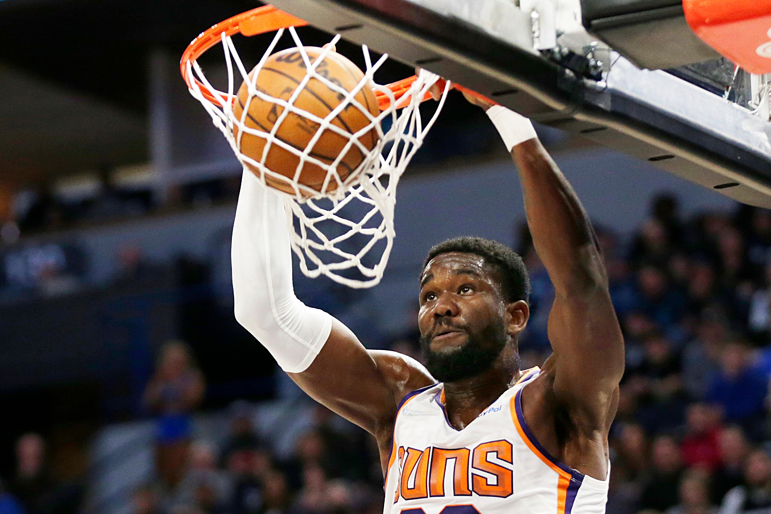 Phoenix Suns center Deandre Ayton dunks against the Minnesota Timberwolves during the second half of an NBA basketball game Wednesday, March 23, 2022, in Minneapolis. (AP Photo/Andy Clayton-King)