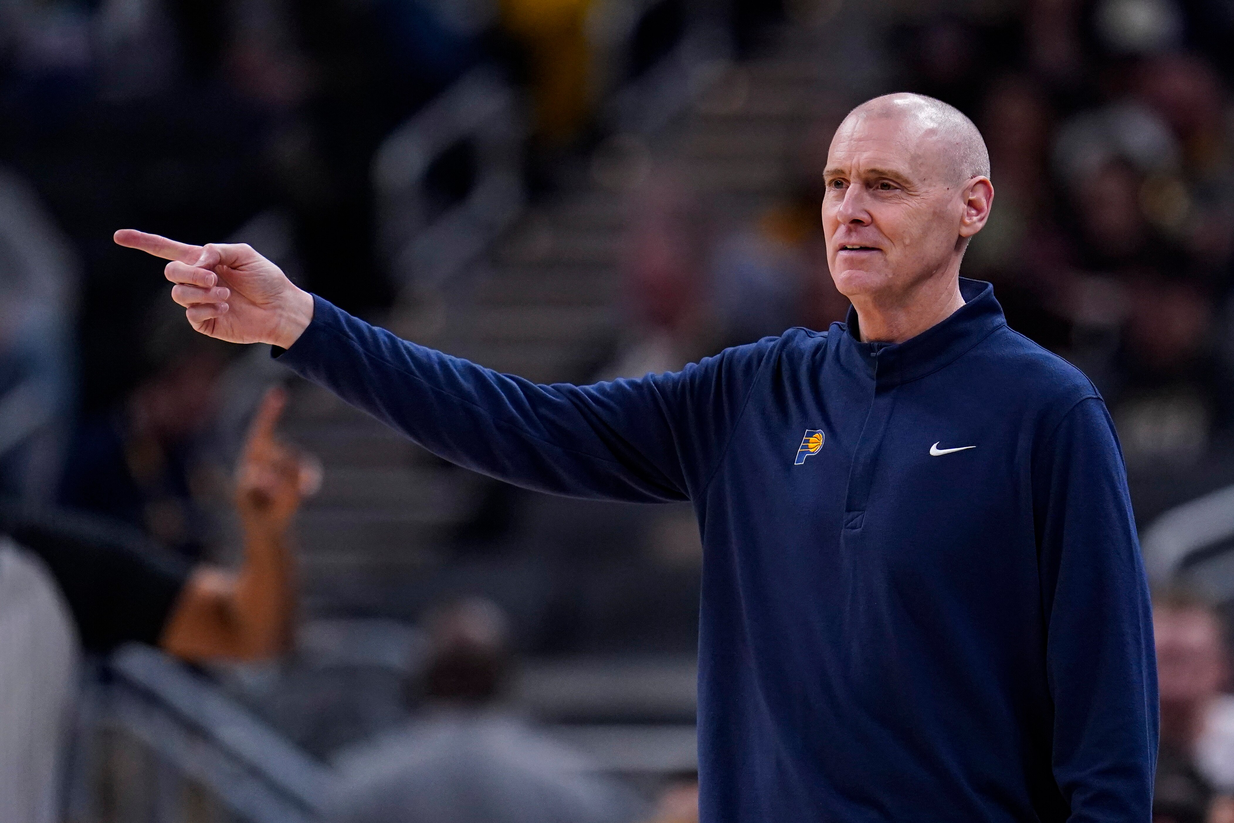 Indiana Pacers head coach Rick Carlisle gestures during the first half of an NBA basketball game against the Portland Trail Blazers in Indianapolis, Sunday, March 20, 2022. (AP Photo/Michael Conroy)