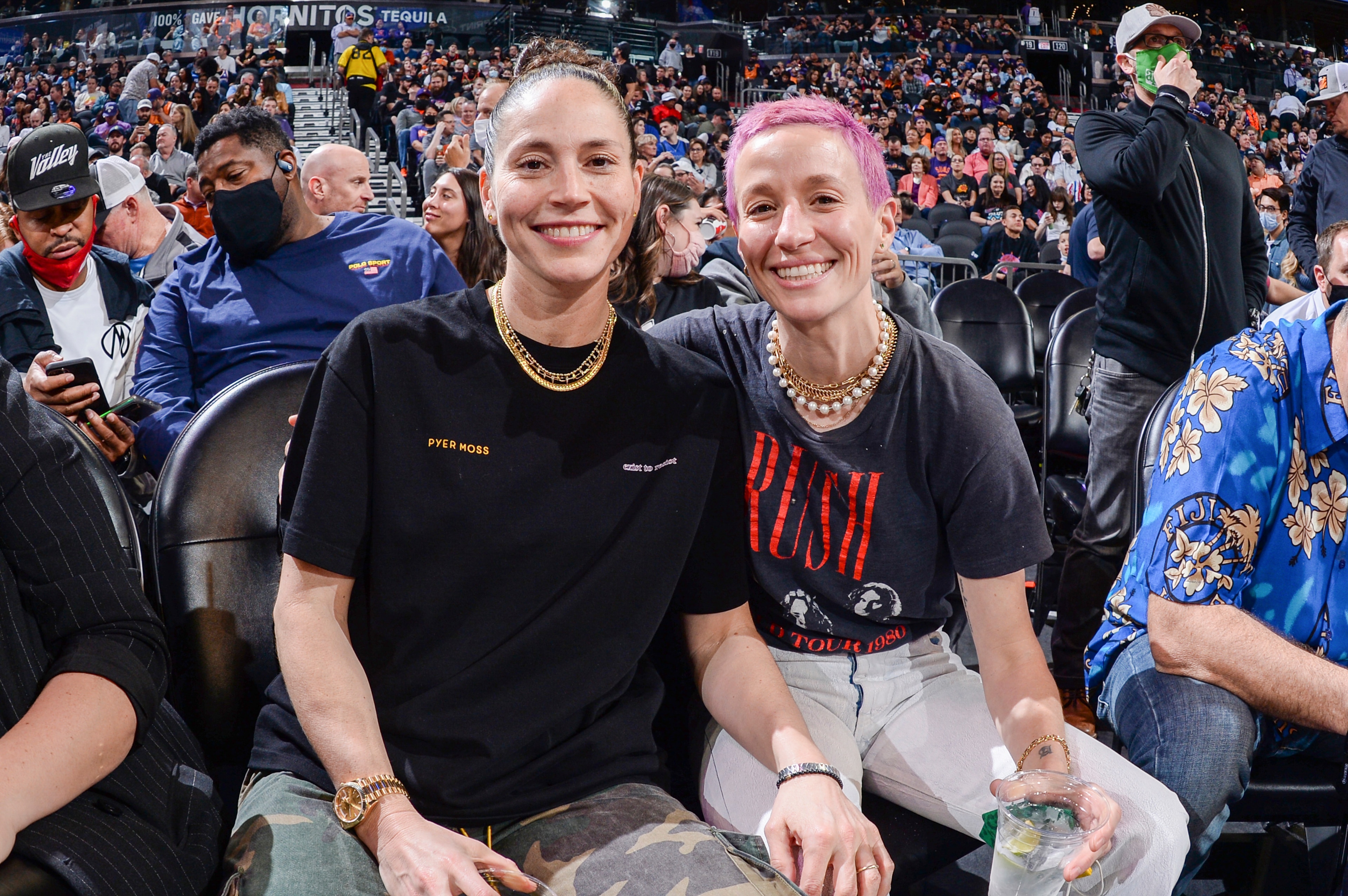 PHOENIX, AZ - NOVEMBER 19: Sue Bird #10 of the Seattle Storm and Soccer Player, Megan Rapinoe attend a game between the Dallas Mavericks and Phoenix Suns on November 19, 2021 at Footprint Center in Phoenix, Arizona. NOTE TO USER: User expressly acknowledges and agrees that, by downloading and or using this photograph, user is consenting to the terms and conditions of the Getty Images License Agreement. Mandatory Copyright Notice: Copyright 2021 NBAE (Photo by Andrew D. Bernstein/NBAE via Getty Images) PHOENIX, AZ - NOVEMBER 19: Sue Bird #10 of the Seattle Storm and Soccer Player, Megan Rapinoe attend a game between the Dallas Mavericks and Phoenix Suns on November 19, 2021 at Footprint Center in Phoenix, Arizona. NOTE TO USER: User expressly acknowledges and agrees that, by downloading and or using this photograph, user is consenting to the terms and conditions of the Getty Images License Agreement. Mandatory Copyright Notice: Copyright 2021 NBAE (Photo by Andrew D. Bernstein/NBAE via Getty Images)