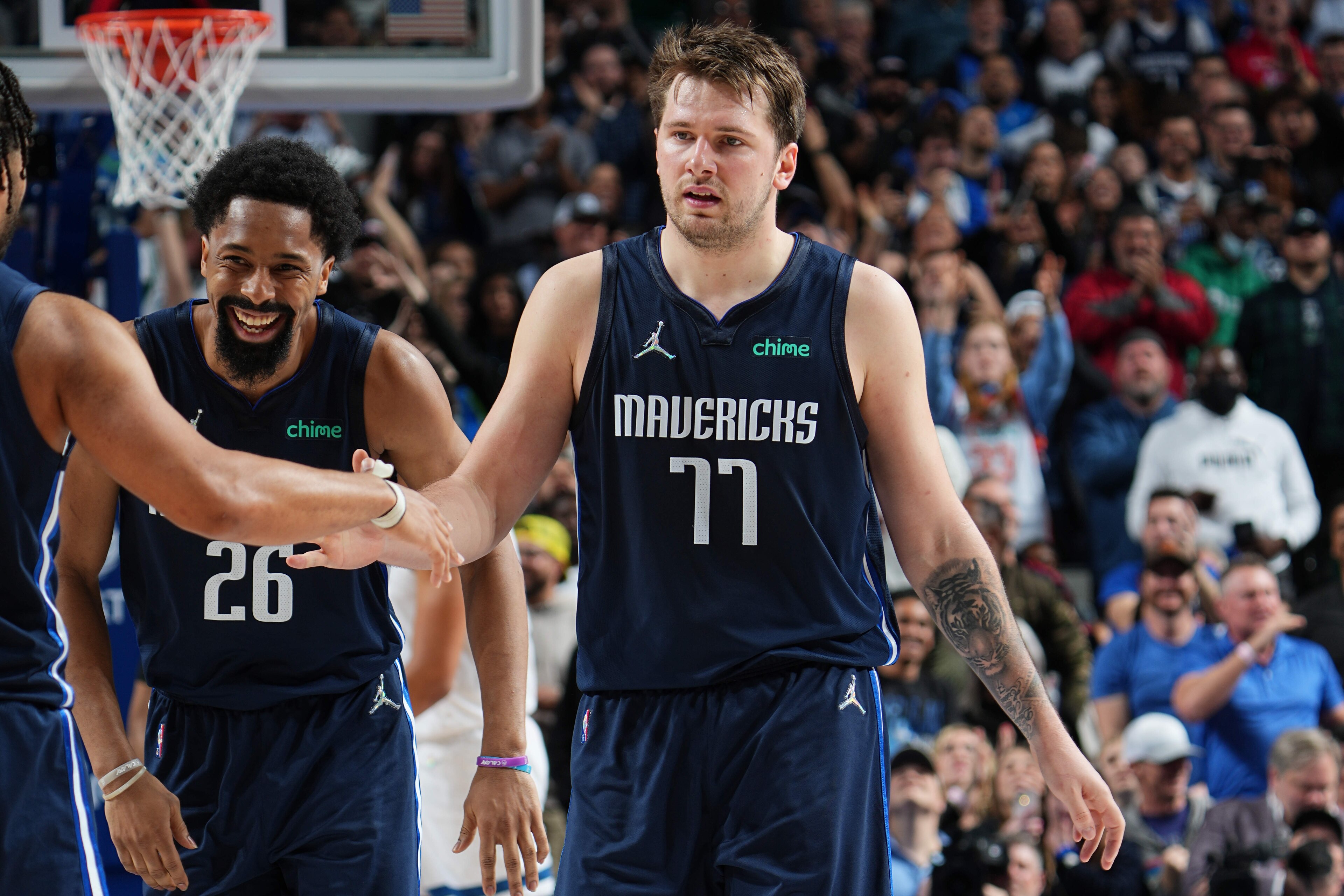 DALLAS, TX - MARCH 21: Luka Doncic #77 of the Dallas Mavericks celebrates during the game against the Minnesota Timberwolves on March 21, 2022 at the American Airlines Center in Dallas, Texas. NOTE TO USER: User expressly acknowledges and agrees that, by downloading and or using this photograph, User is consenting to the terms and conditions of the Getty Images License Agreement. Mandatory Copyright Notice: Copyright 2022 NBAE (Photo by Glenn James/NBAE via Getty Images)