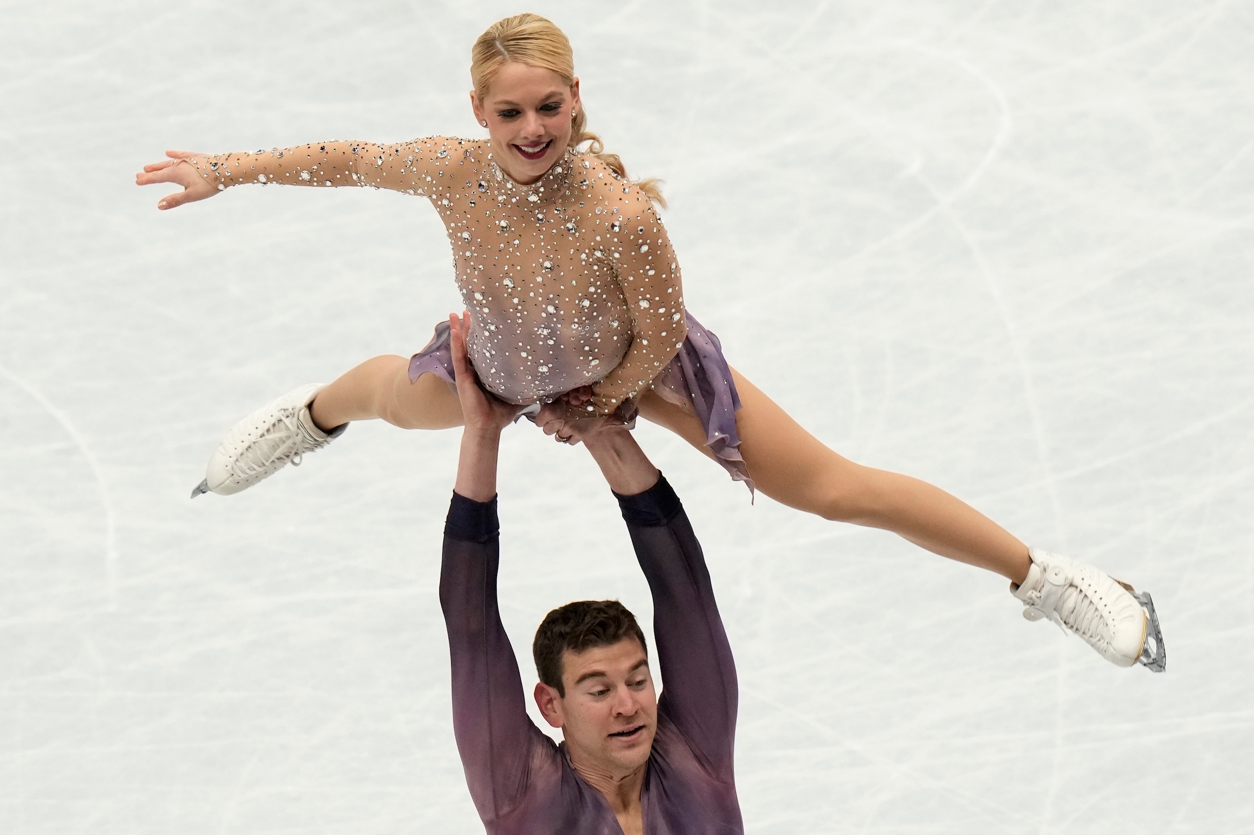 Alexa Knierim and Brandon Frazier, of the U.S, perform in the pairs free program at the Figure Skating World Championships in Montpellier, south of France, Thursday, March 24, 2022. (AP Photo/Francisco Seco)