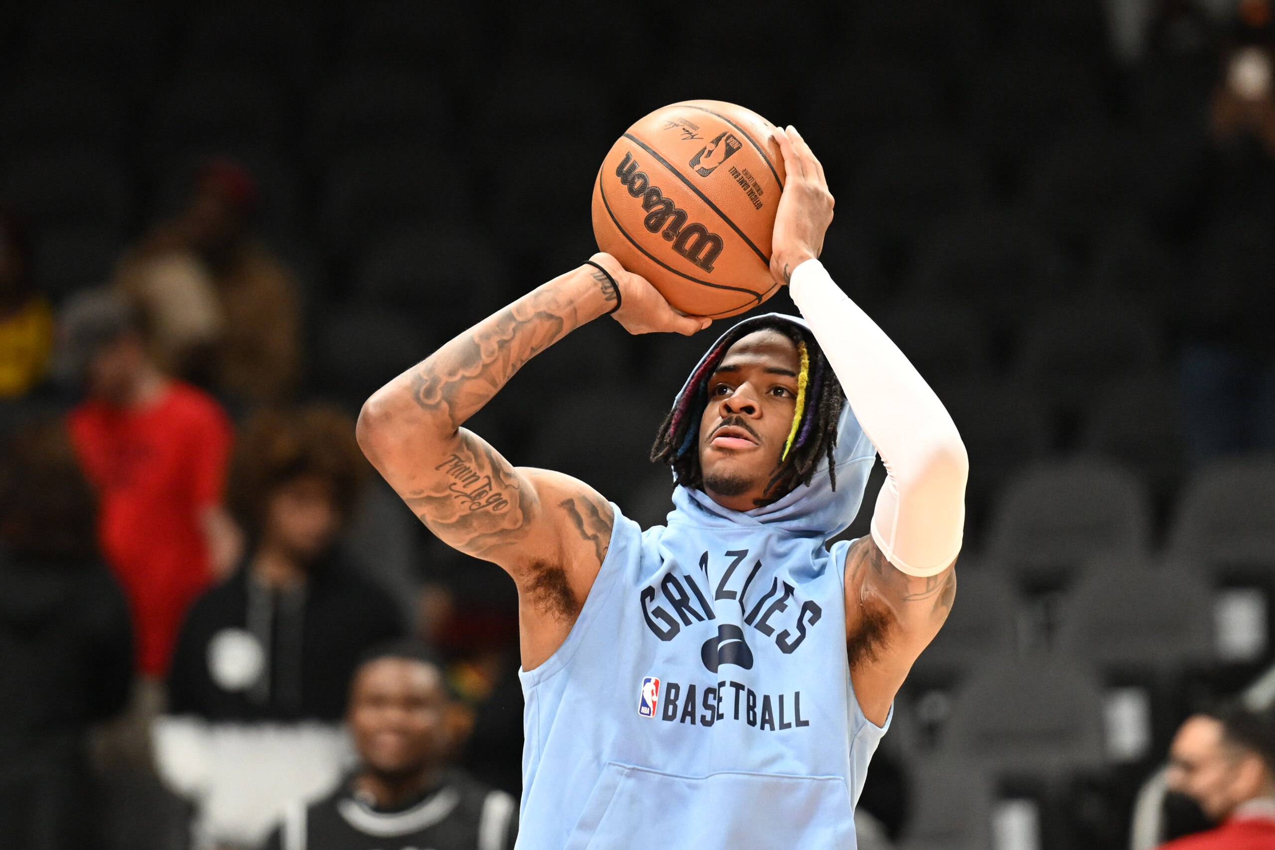 ATLANTA, GA - MARCH 18: Ja Morant #12 of the Memphis Grizzlies warms up before the game against the Atlanta Hawks on March 18, 2022 at State Farm Arena in Atlanta, Georgia.  NOTE TO USER: User expressly acknowledges and agrees that, by downloading and/or using this Photograph, user is consenting to the terms and conditions of the Getty Images License Agreement. Mandatory Copyright Notice: Copyright 2022 NBAE (Photo by Adam Hagy/NBAE via Getty Images)