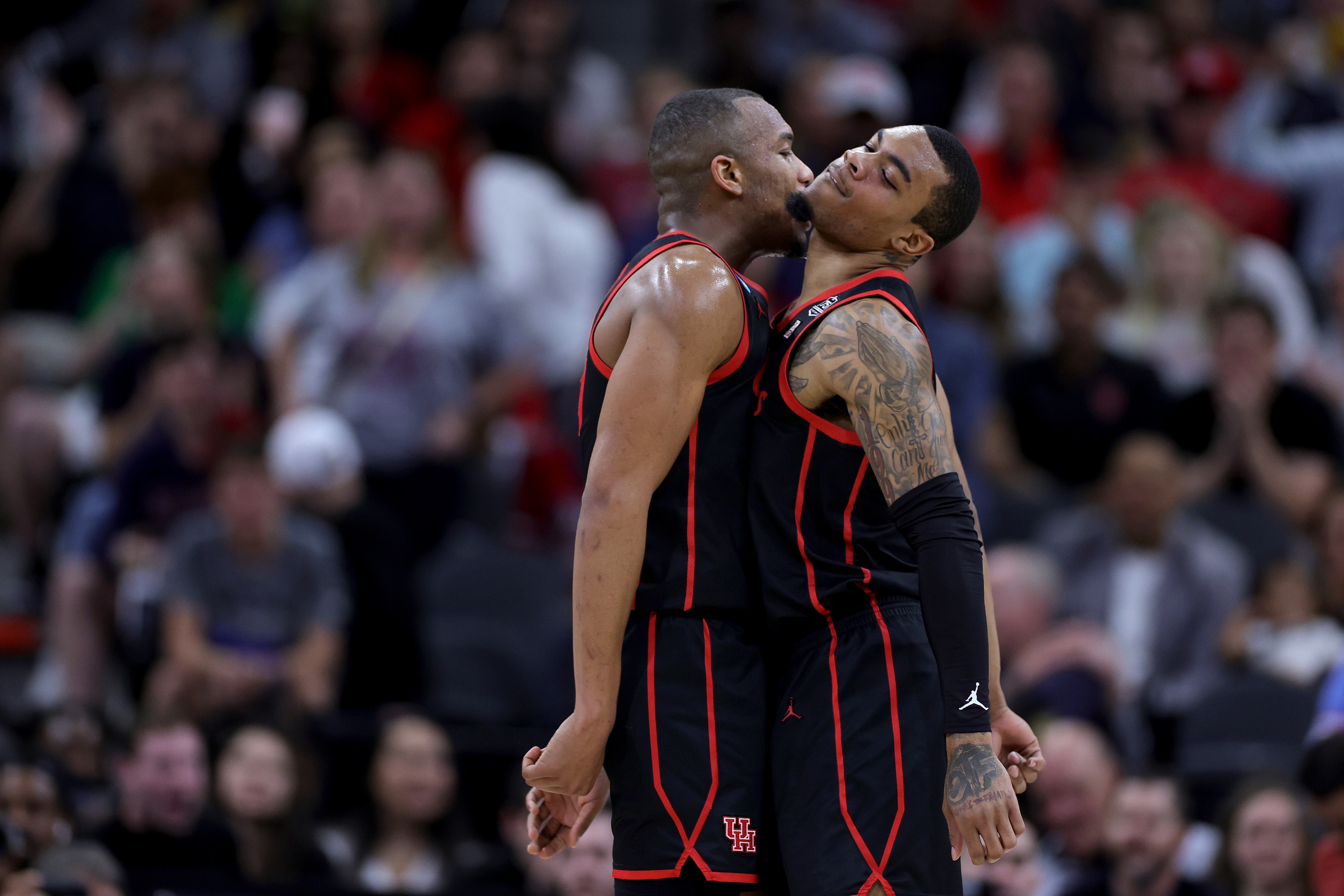 SAN ANTONIO, TEXAS - MARCH 24: Fabian White Jr. #35 and Reggie Chaney #32 of the Houston Cougars reacts during the first half against the Arizona Wildcats in the NCAA Men's Basketball Tournament Sweet 16 Round at AT&T Center on March 24, 2022 in San Antonio, Texas. (Photo by Carmen Mandato/Getty Images)