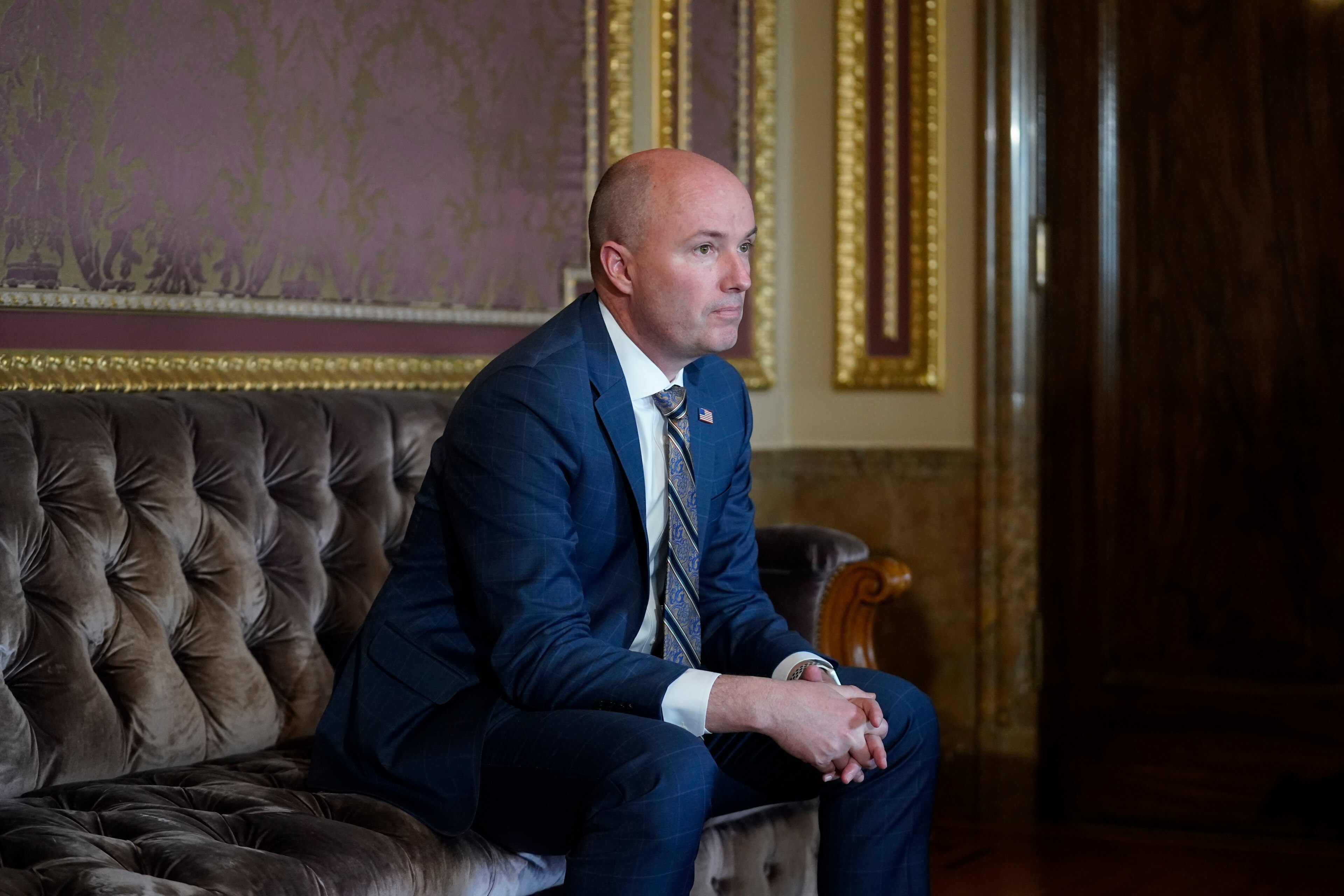 Utah Gov. Spencer Cox looks on during an interview at the Utah State Capitol Friday, March 4, 2022, in Salt Lake City. Some police statements made during internal investigations into shootings and other high-profile incidents will no longer be accessible to the public under a law that Cox plans to sign. (AP Photo/Rick Bowmer)
