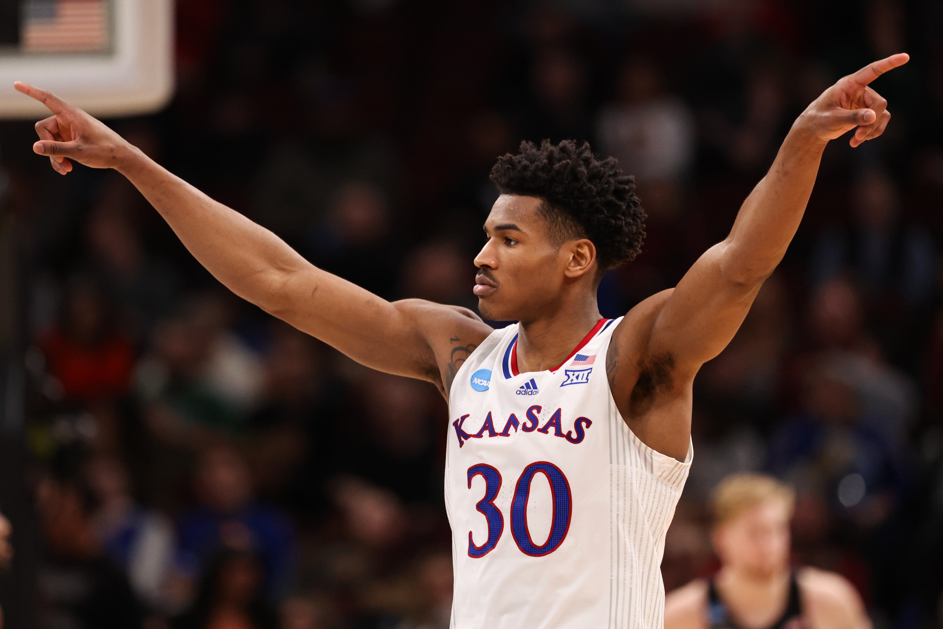 CHICAGO, IL - MARCH 25: Ochai Agbaji #30 of the Kansas Jayhawks reacts against the Providence Friars during the Sweet 16 round of the 2022 NCAA Mens Basketball Tournament held at United Center on March 25, 2022 in Chicago, Illinois. (Photo by Isaiah Vazquez/NCAA Photos via Getty Images)