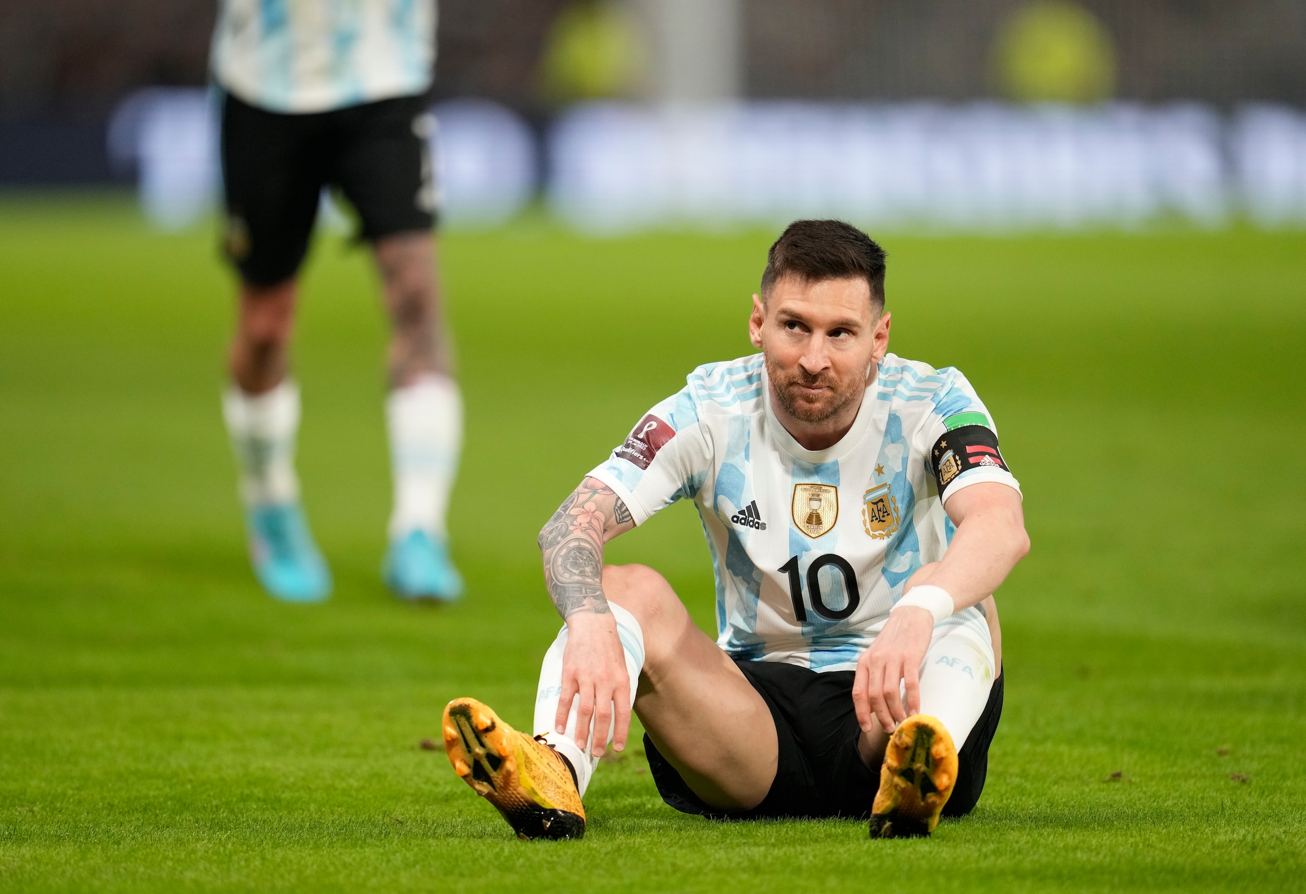 Argentina's Lionel Messi reacts after falling down on the pitch during a qualifying soccer match for the FIFA World Cup Qatar 2022 against Venezuela, at the Bombonera stadium in Buenos Aires, Argentina, Friday, March 25, 2022.(AP Photo/Natacha Pisarenko) Argentina's Lionel Messi reacts after falling down on the pitch during a qualifying soccer match for the FIFA World Cup Qatar 2022 against Venezuela, at the Bombonera stadium in Buenos Aires, Argentina, Friday, March 25, 2022.(AP Photo/Natacha Pisarenko)