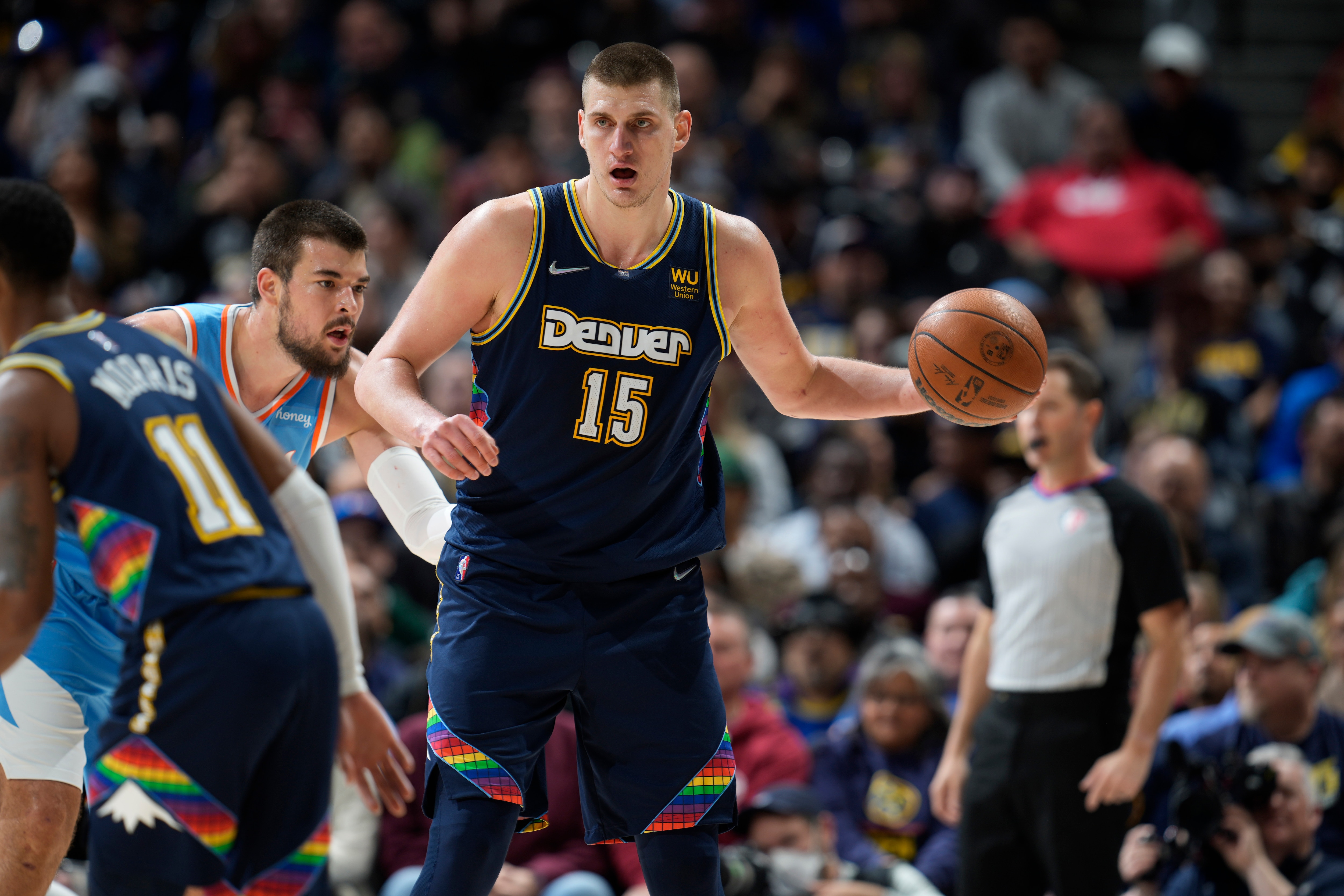 Los Angeles Clippers center Ivica Zubac (40) and Denver Nuggets center Nikola Jokic (15) in the second half of an NBA basketball game Tuesday, March 22, 2022, in Denver. (AP Photo/David Zalubowski)
