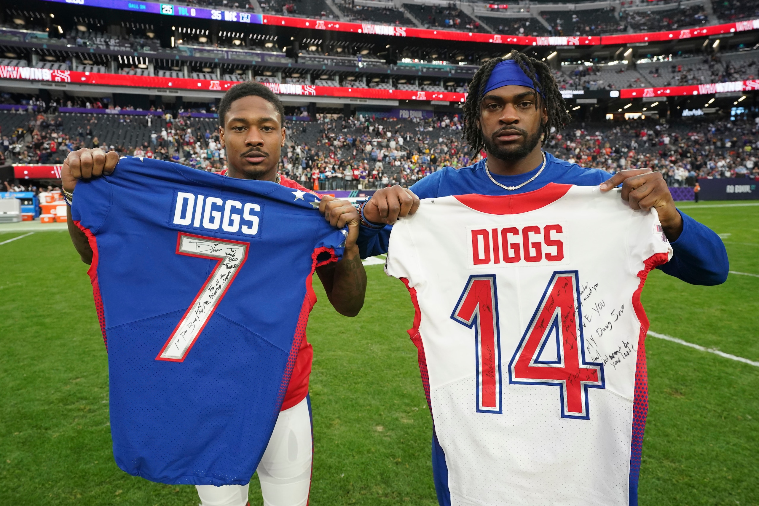 AFC wide receiver Stefon Diggs of the Buffalo Bills, left, and NFC cornerback Trevon Diggs of the Dallas Cowboys pose with the jerseys each player signed for the other after the AFC defeated the NFC in the NFL Pro Bowl on Sunday, Feb. 6, 2022 in Las Vegas. (Doug Benc/AP Images for NFL)