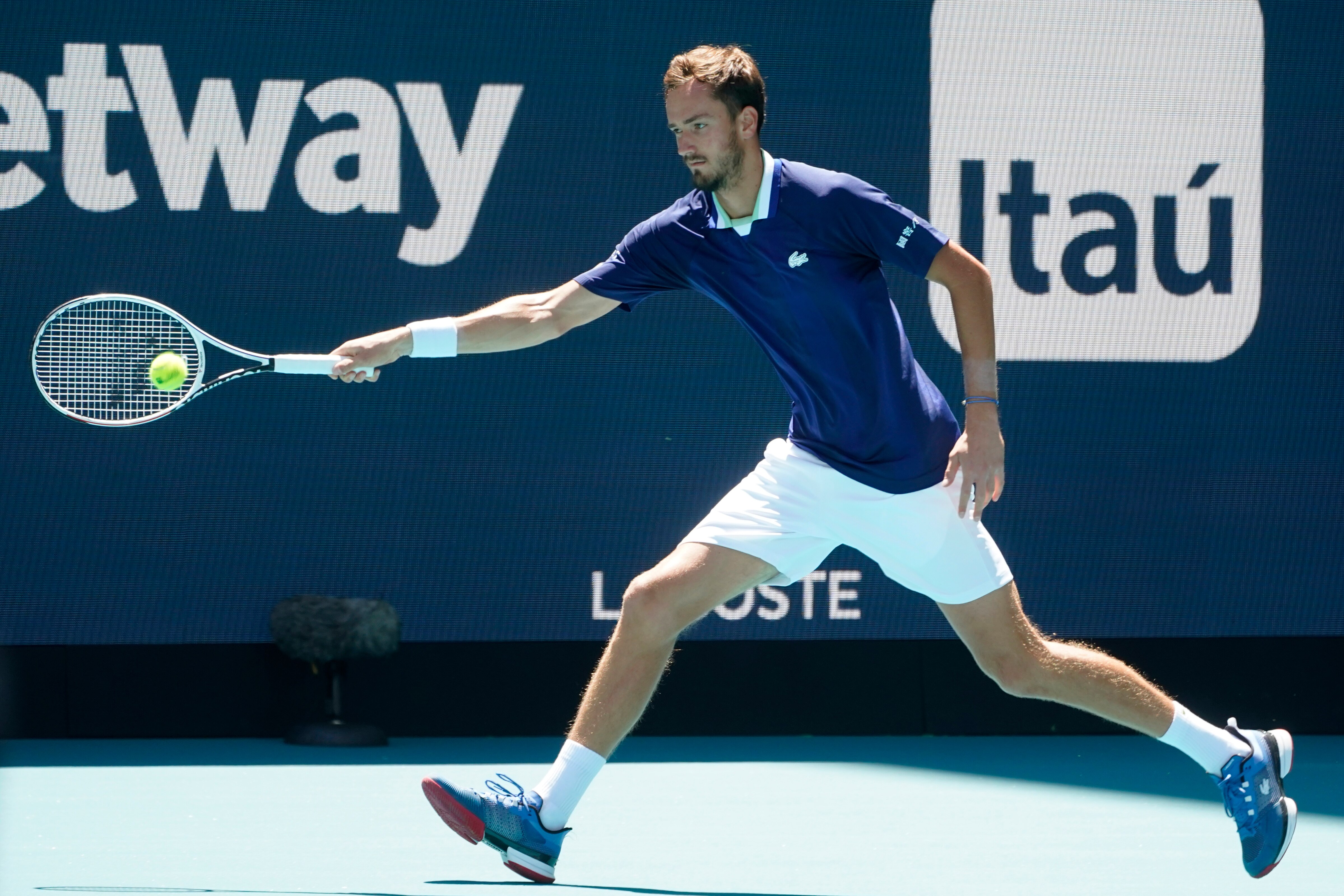 Daniil Medvedev, of Russia, returns a shot from Andy Murray, of Britain, during the Miami Open tennis tournament, Saturday, March 26, 2022, in Miami Gardens, Fla. (AP Photo/Wilfredo Lee)