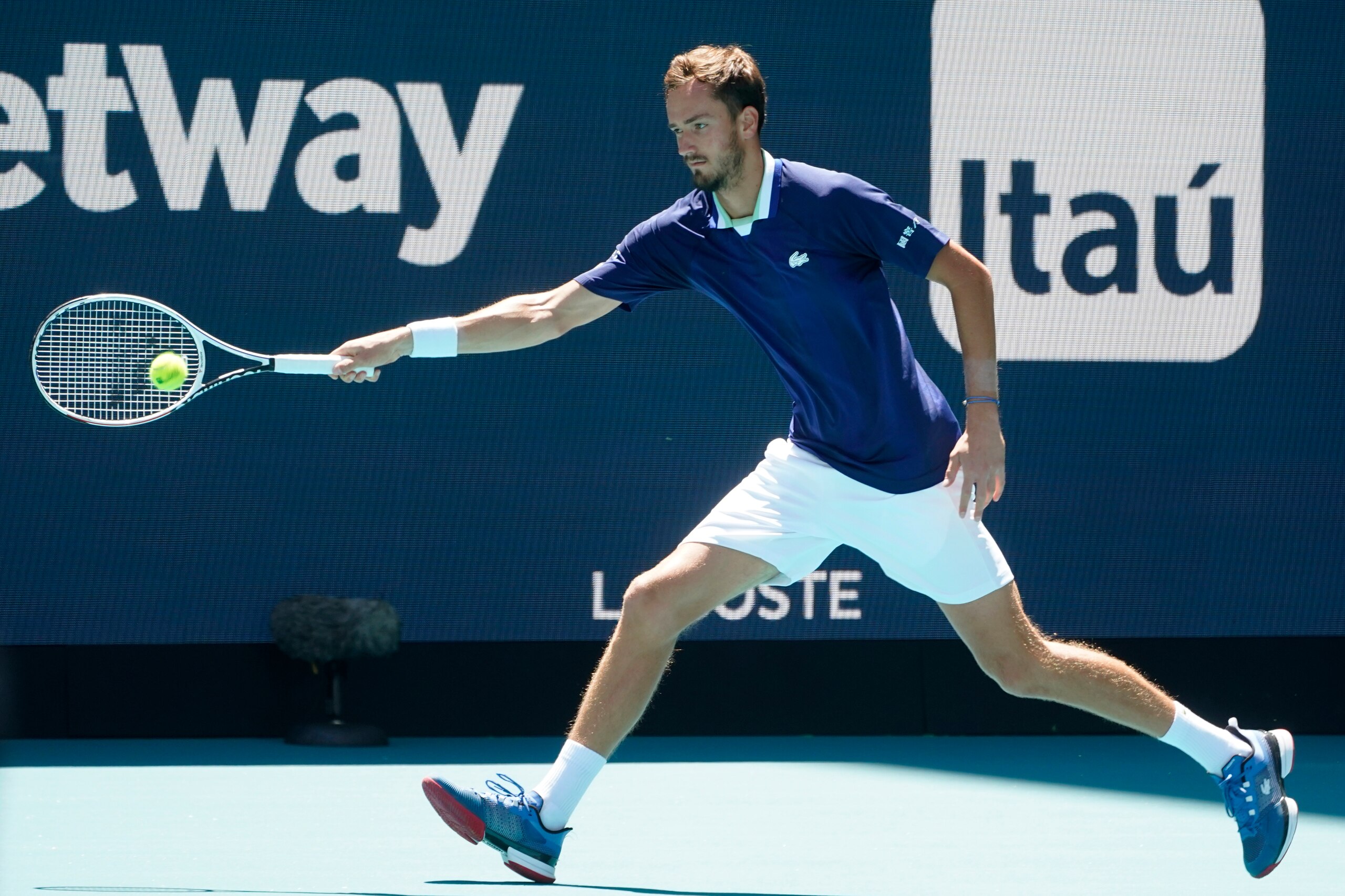 Daniil Medvedev, of Russia, returns a shot from Andy Murray, of Britain, during the Miami Open tennis tournament, Saturday, March 26, 2022, in Miami Gardens, Fla. (AP Photo/Wilfredo Lee)