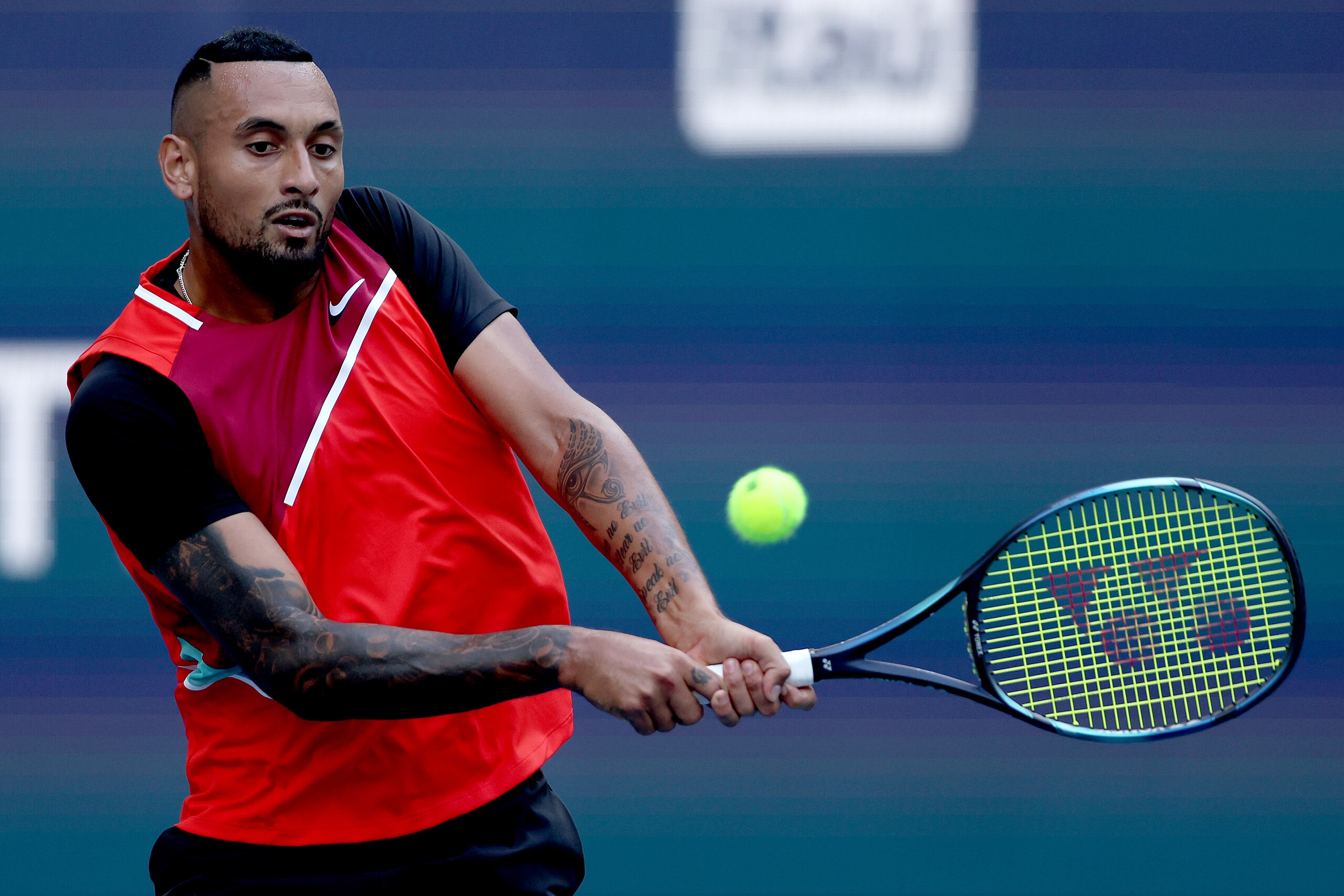 MIAMI GARDENS, FLORIDA - MARCH 25: Nick Kyrgios of Australia returns a shot to Andrey Rublev of Russia during the Miami Open at Hard Rock Stadium on March 25, 2022 in Miami Gardens, Florida. (Photo by Matthew Stockman/Getty Images)