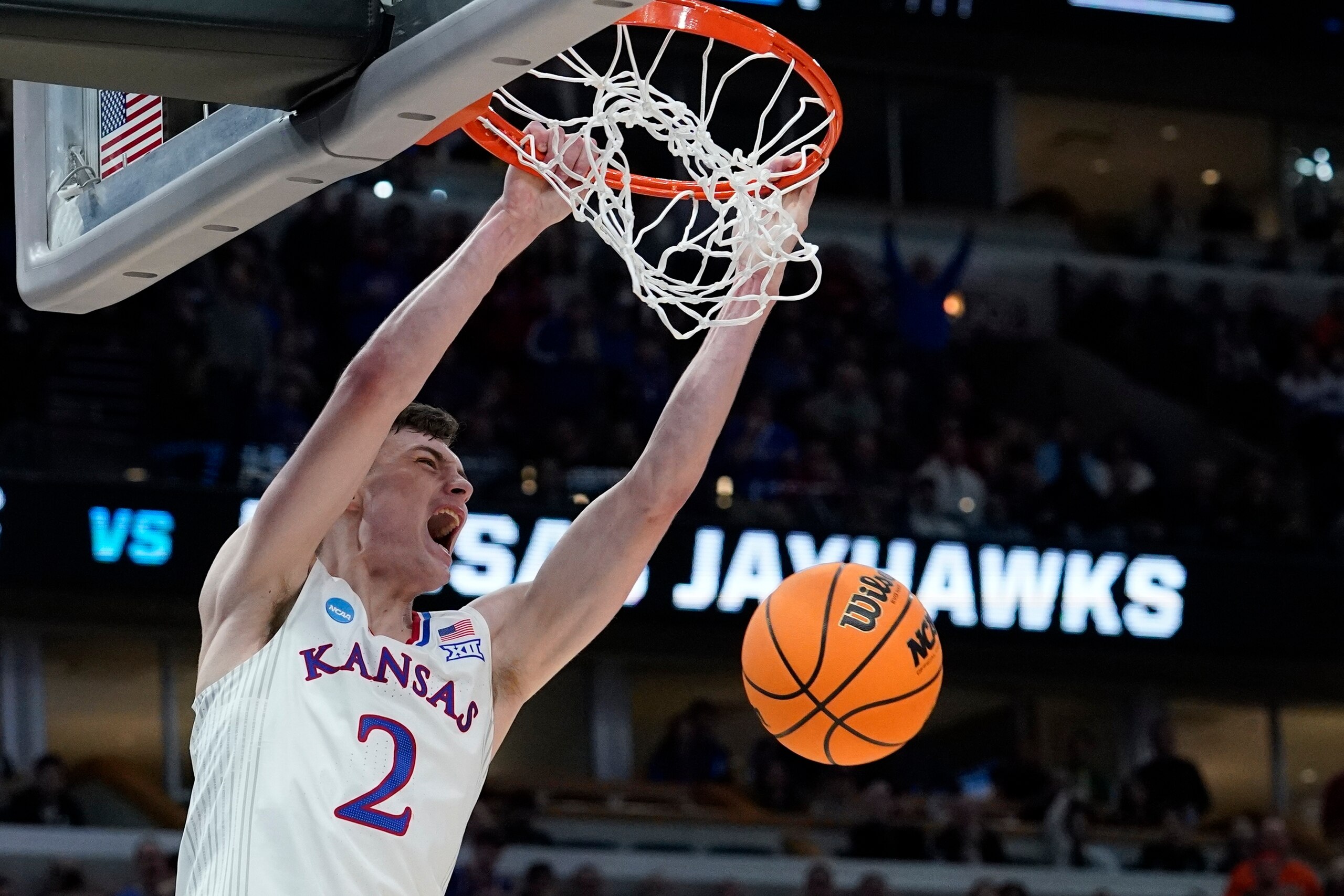 Kansas' Christian Braun dunks during the second half of a college basketball game in the Elite 8 round of the NCAA tournament Sunday, March 27, 2022, in Chicago. (AP Photo/Nam Y. Huh)