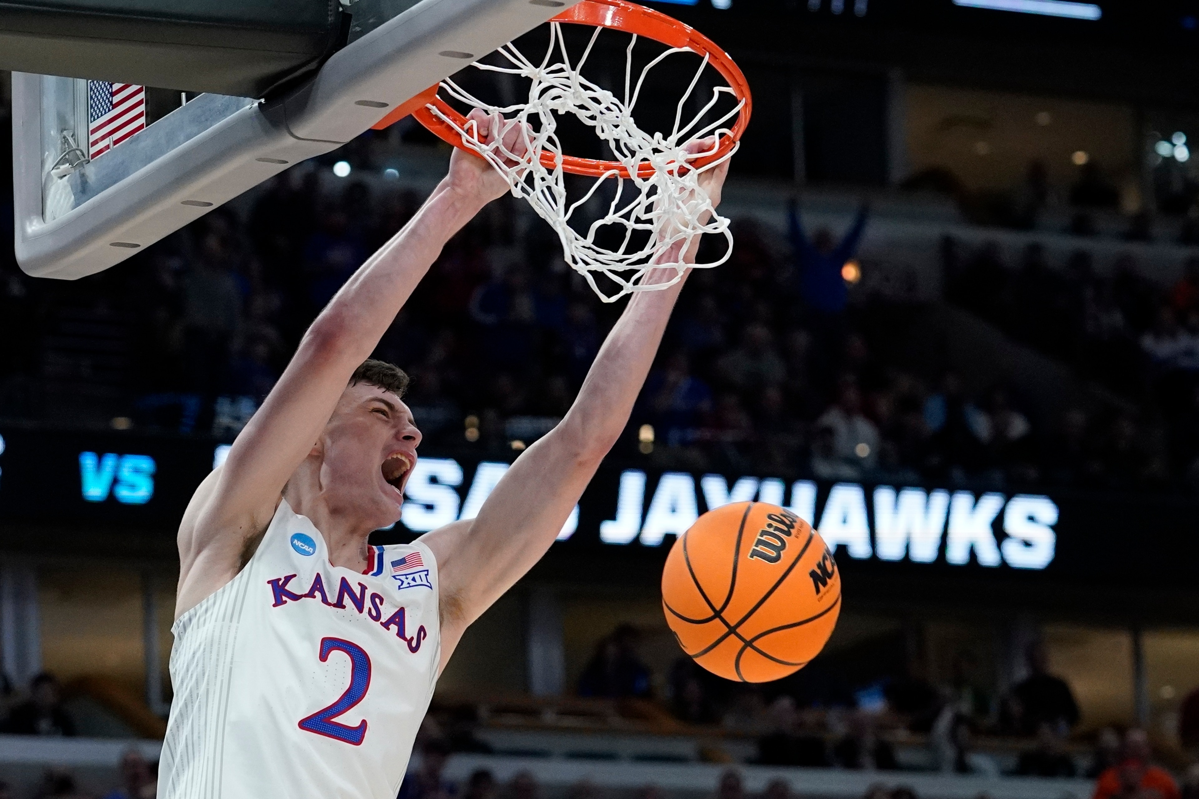 Kansas' Christian Braun dunks during the second half of a college basketball game in the Elite 8 round of the NCAA tournament Sunday, March 27, 2022, in Chicago. (AP Photo/Nam Y. Huh)