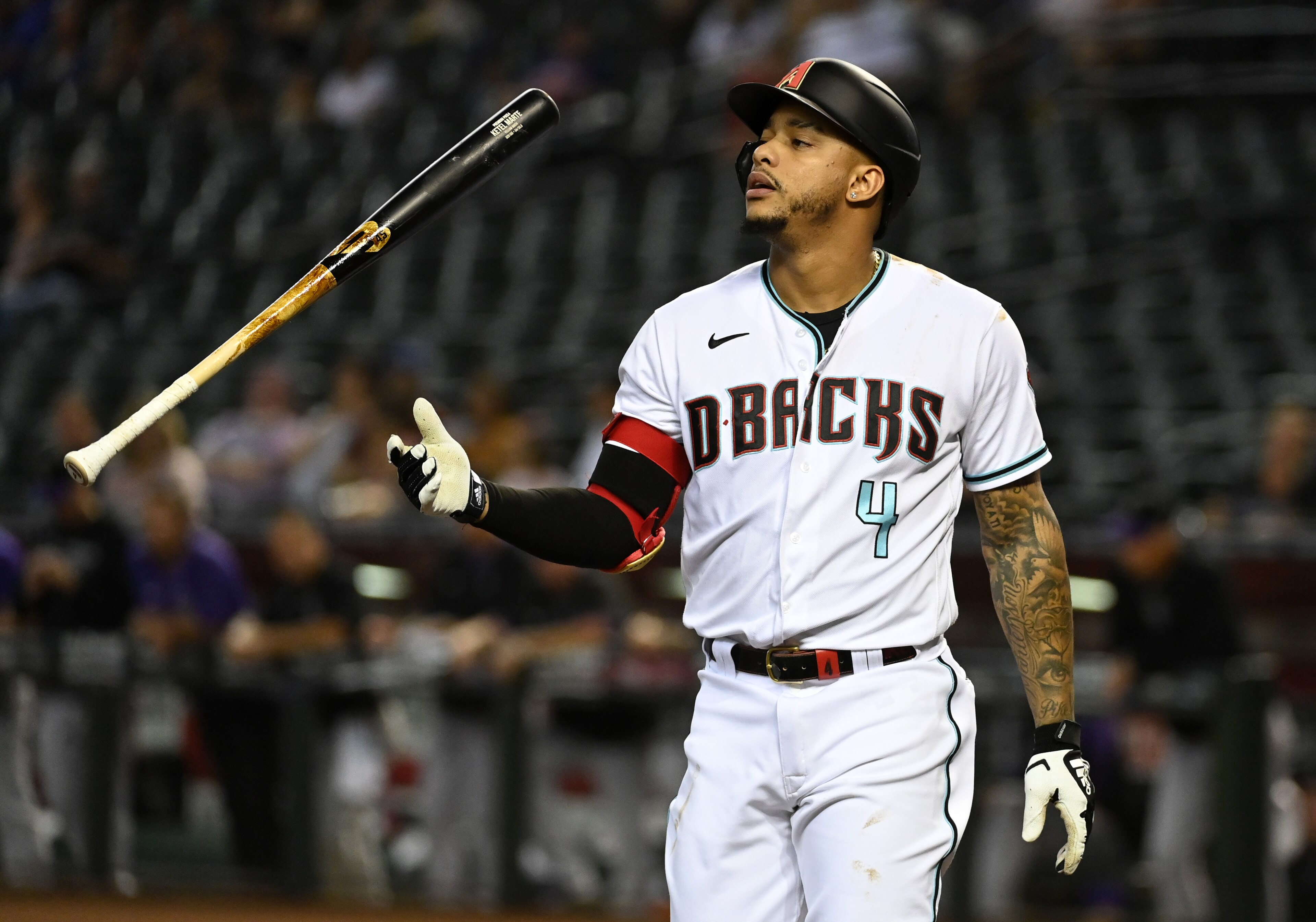 PHOENIX, ARIZONA - OCTOBER 01: Ketel Marte #4 of the Arizona Diamondbacks tosses his bat after being called out on strikes against the Colorado Rockies during the first inning at Chase Field on October 01, 2021 in Phoenix, Arizona. (Photo by Norm Hall/Getty Images)
