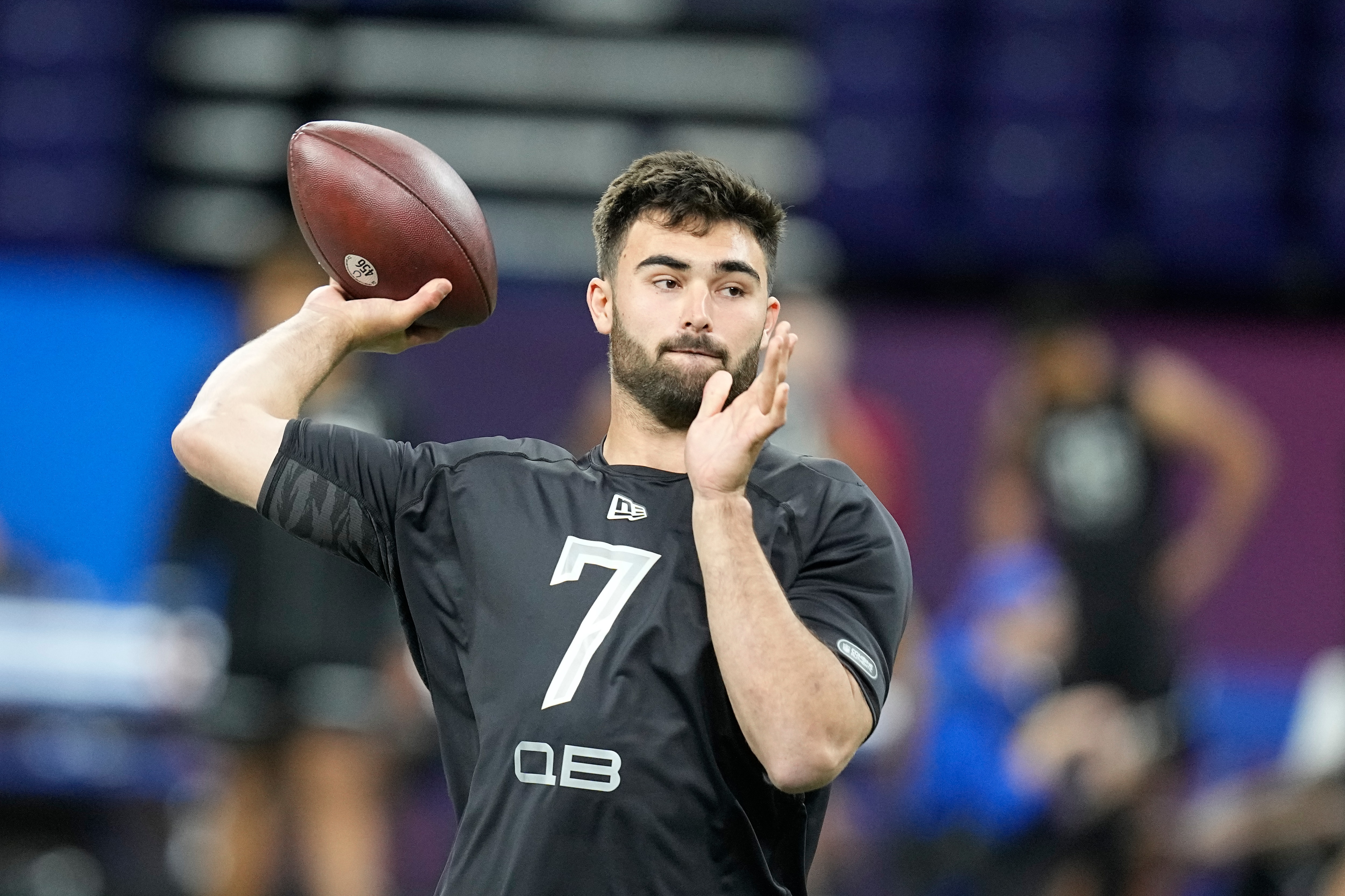North Carolina quarterback Sam Howell throws during the NFL football scouting combine, Thursday, March 3, 2022, in Indianapolis. (AP Photo/Darron Cummings)