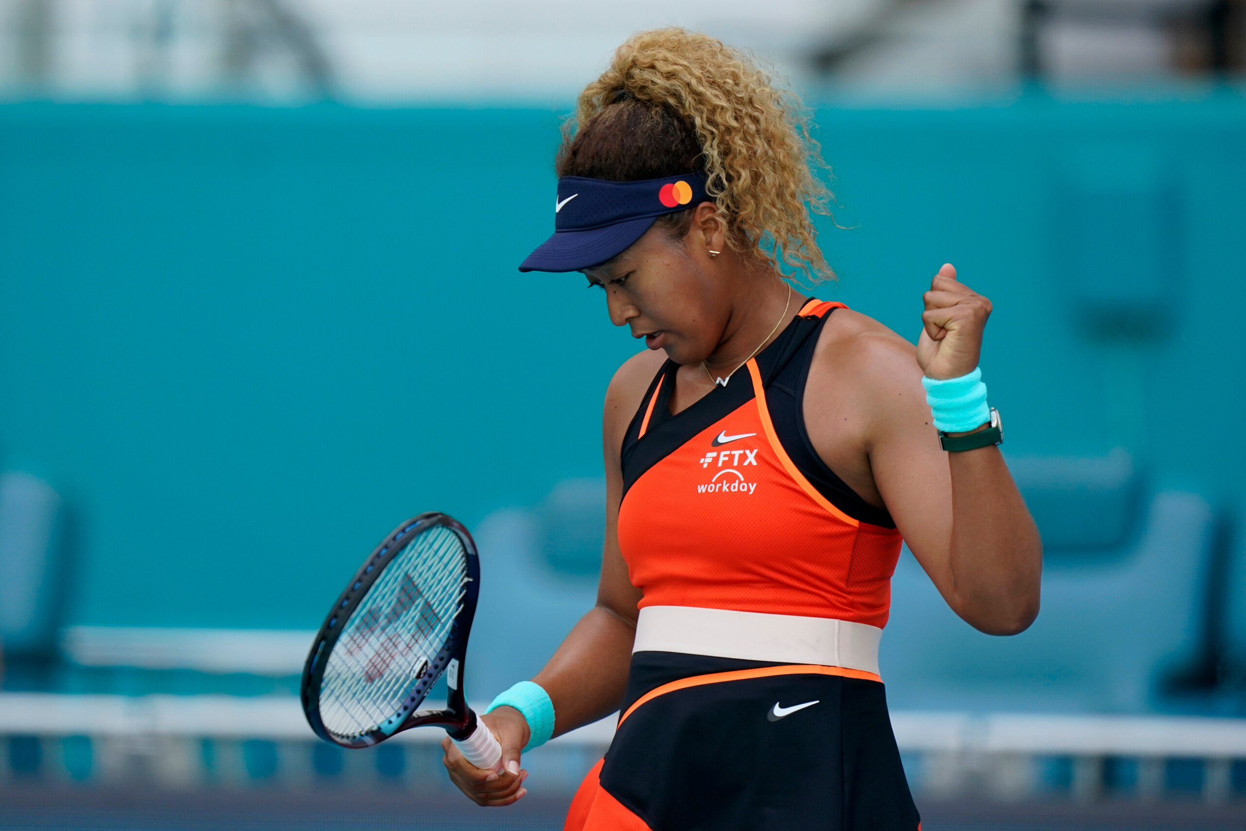 Naomi Osaka, of Japan, celebrates a point against Alison Riske during the Miami Open tennis tournament, Monday, March 28, 2022, in Miami Gardens, Fla. (AP Photo/Wilfredo Lee)