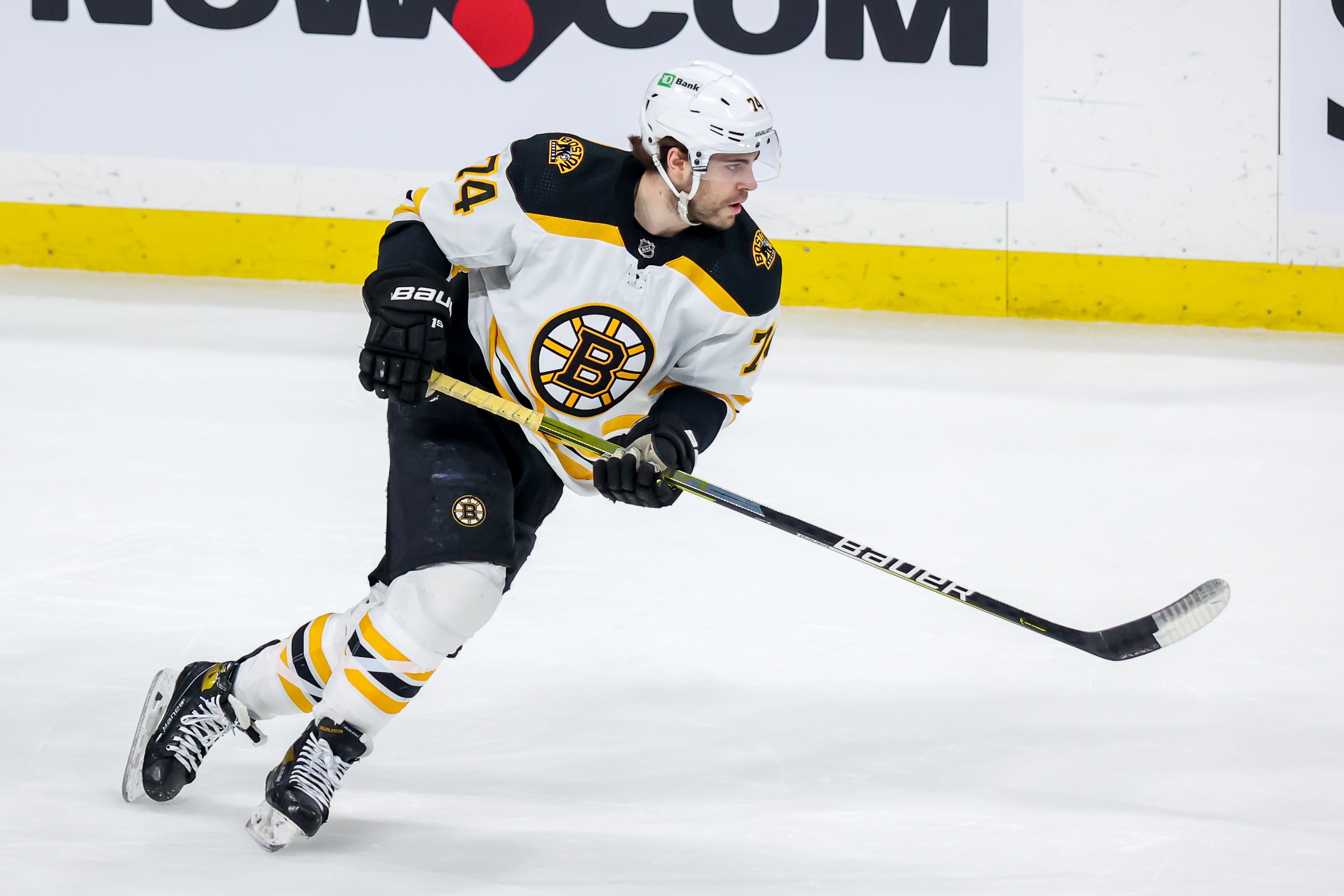 WINNIPEG, MB - MARCH 18: Jake DeBrusk #74 of the Boston Bruins follows the play up the ice during first period action against the Winnipeg Jets at Canada Life Centre on March 18, 2022 in Winnipeg, Manitoba, Canada. (Photo by Jonathan Kozub/NHLI via Getty Images)