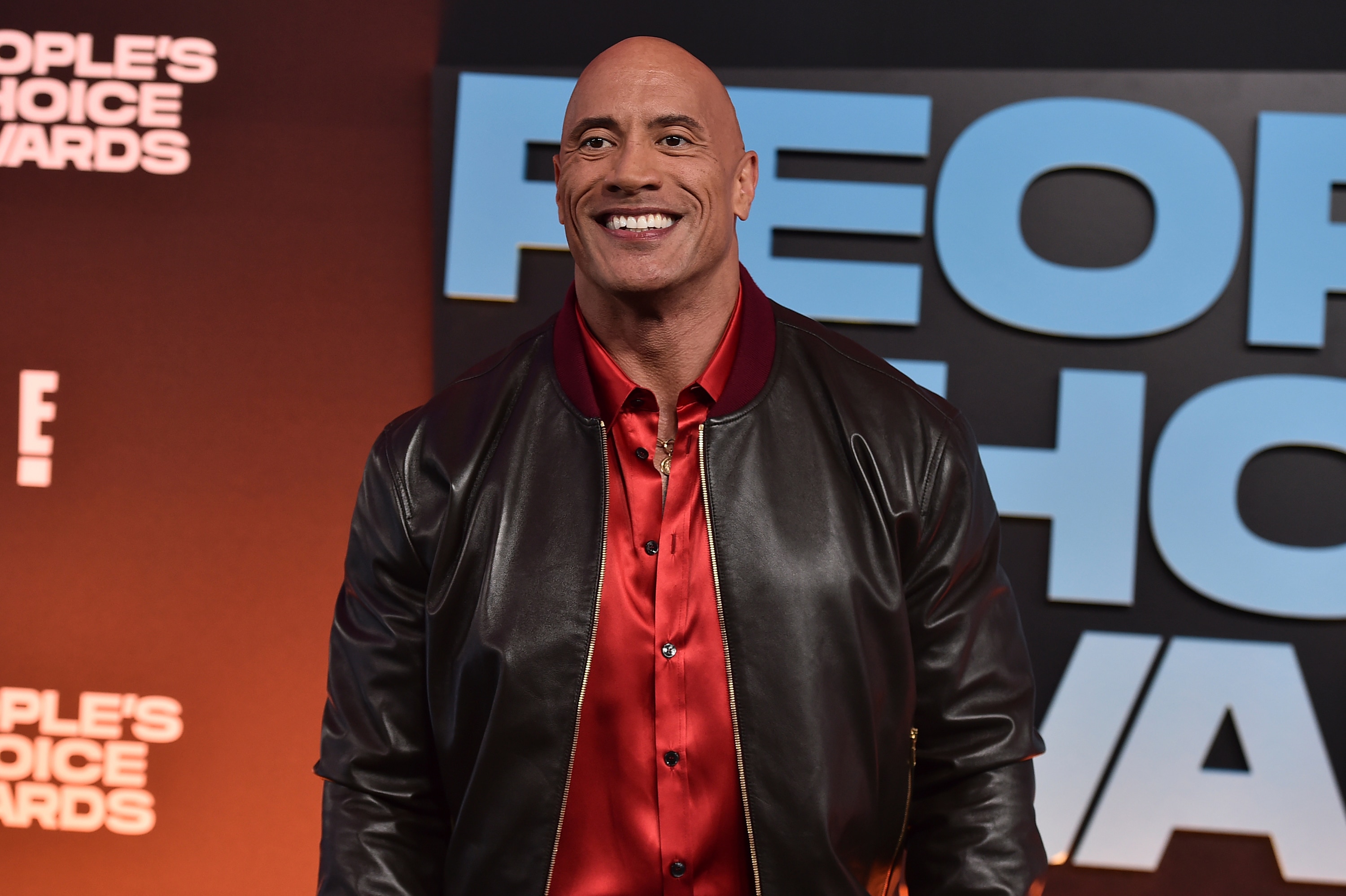 Dwayne "The Rock" Johnson arrives at the People's Choice Awards on Tuesday, Dec. 7, 2021, at the Barker Hangar in Santa Monica, Calif. (Photo by Jordan Strauss/Invision/AP)