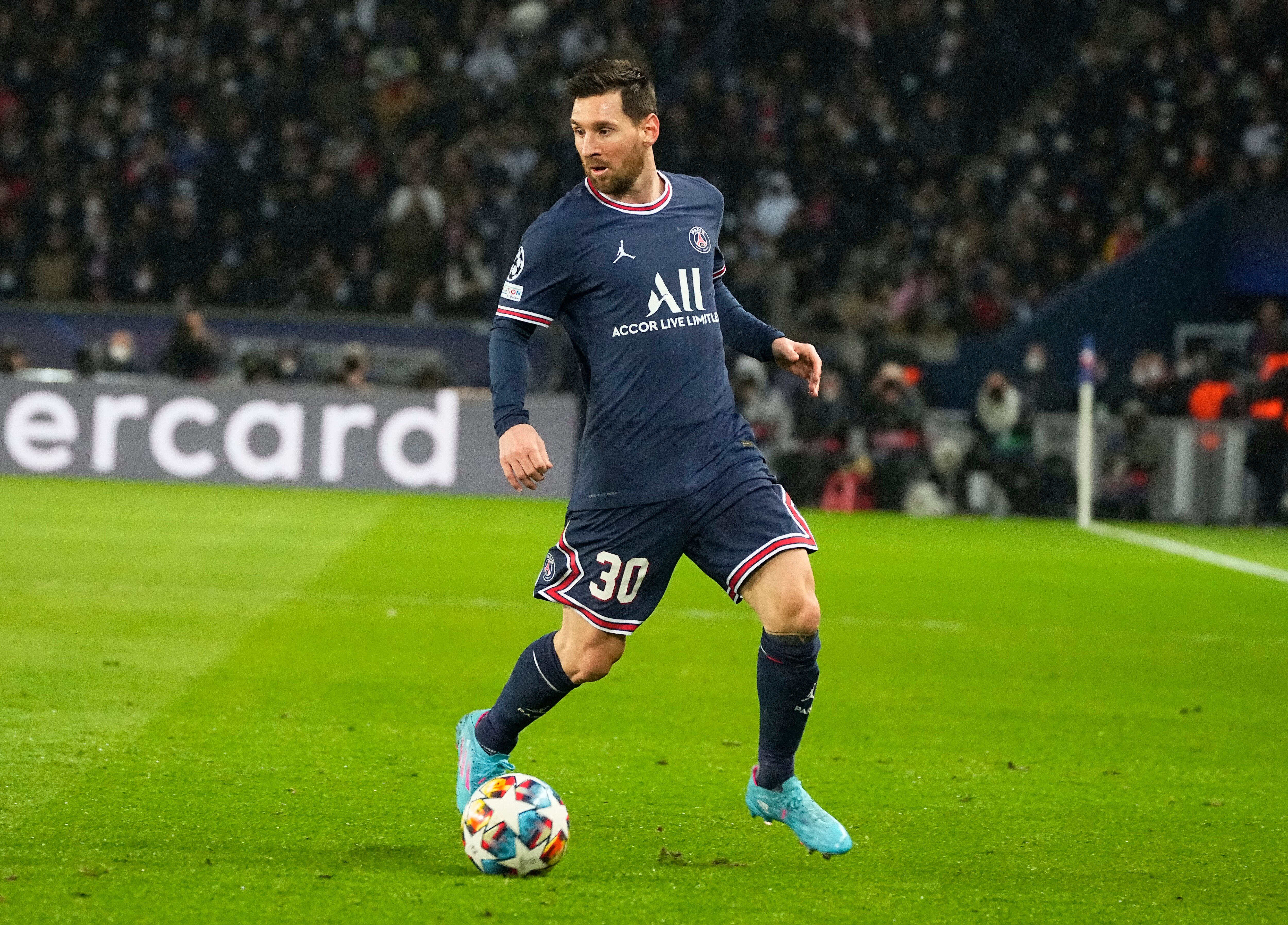 PSG's Lionel Messi controls the balll during the Champions League round of 16, first leg, soccer match Paris Saint-Germain against Real Madrid at the Parc des Princes stadium in Paris, Tuesday, Feb.15, 2022. (AP Photo/Michel Euler)