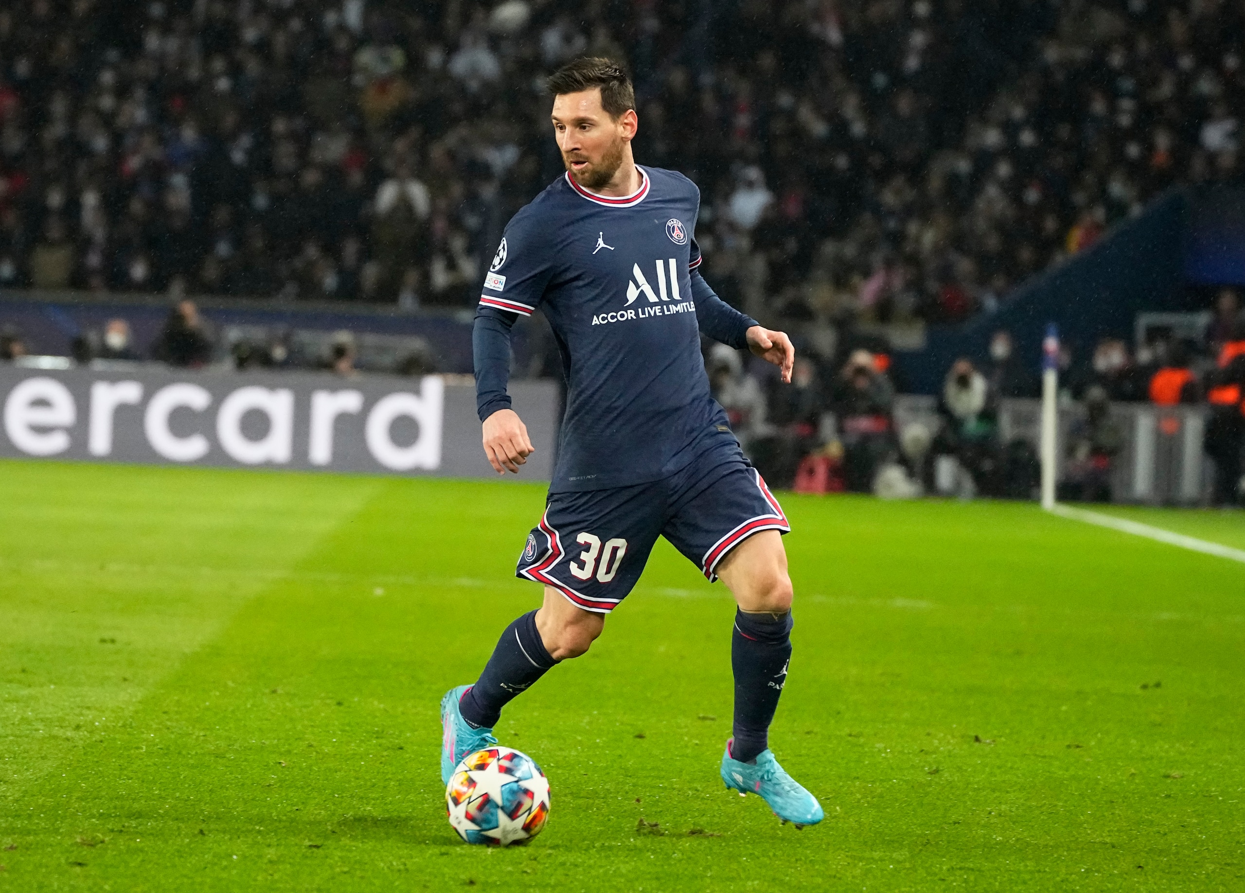 PSG's Lionel Messi controls the balll during the Champions League round of 16, first leg, soccer match Paris Saint-Germain against Real Madrid at the Parc des Princes stadium in Paris, Tuesday, Feb.15, 2022. (AP Photo/Michel Euler)