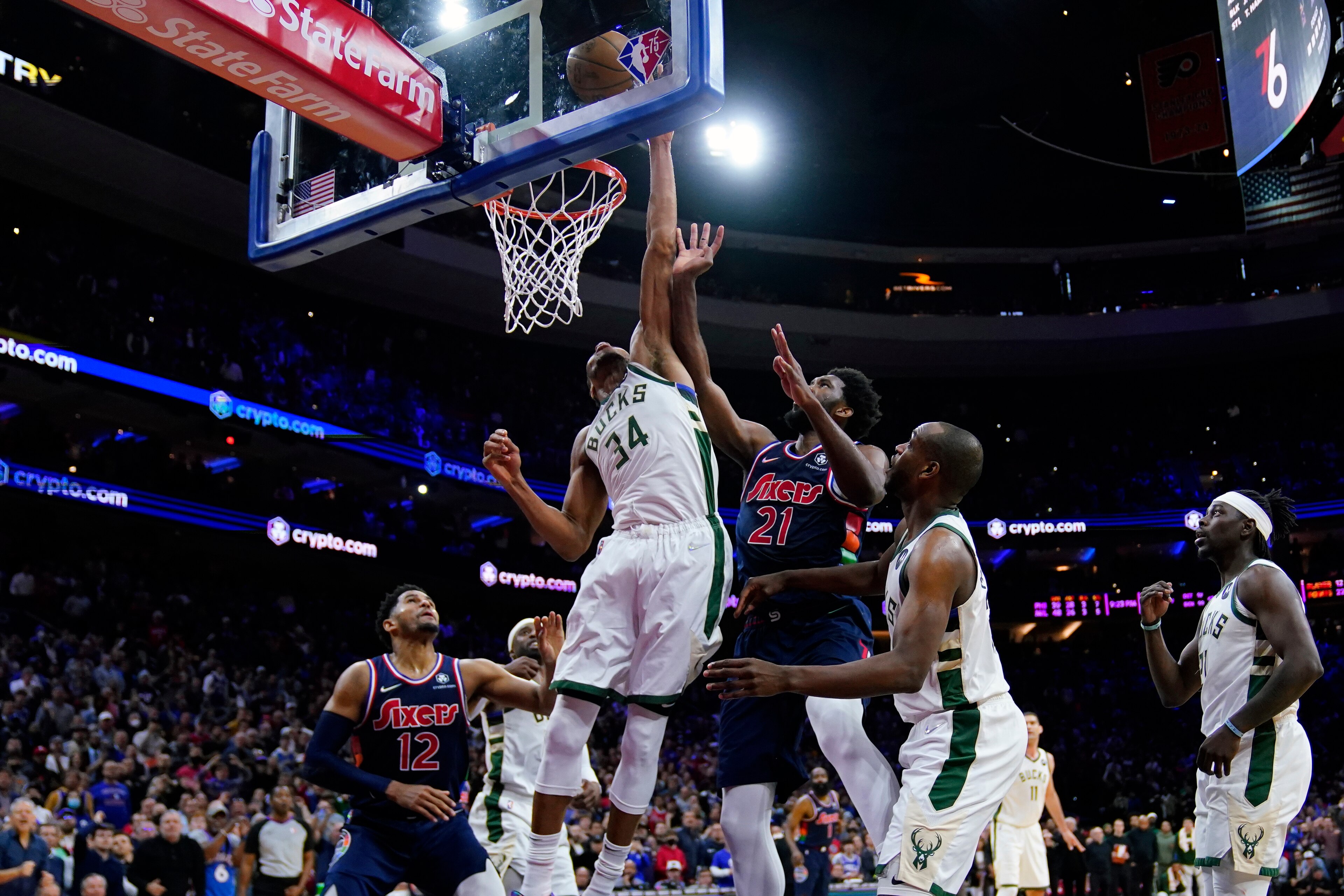 Milwaukee Bucks' Giannis Antetokounmpo (34) blocks a shot by Philadelphia 76ers' Joel Embiid (21) in the final seconds of an NBA basketball game, Tuesday, March 29, 2022, in Philadelphia. (AP Photo/Matt Slocum) Milwaukee Bucks' Giannis Antetokounmpo (34) blocks a shot by Philadelphia 76ers' Joel Embiid (21) in the final seconds of an NBA basketball game, Tuesday, March 29, 2022, in Philadelphia. (AP Photo/Matt Slocum)