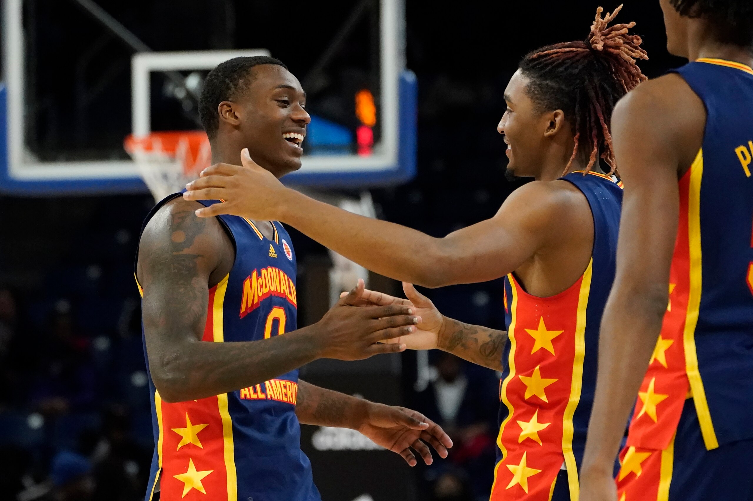 East boy's Dariq Whitehead, left, and Arterio Morris celebrate near the end of the McDonald's All-American Boys basketball game against the West team Tuesday, March 29, 2022, in Chicago. The East won 102-75. (AP Photo/Charles Rex Arbogast)