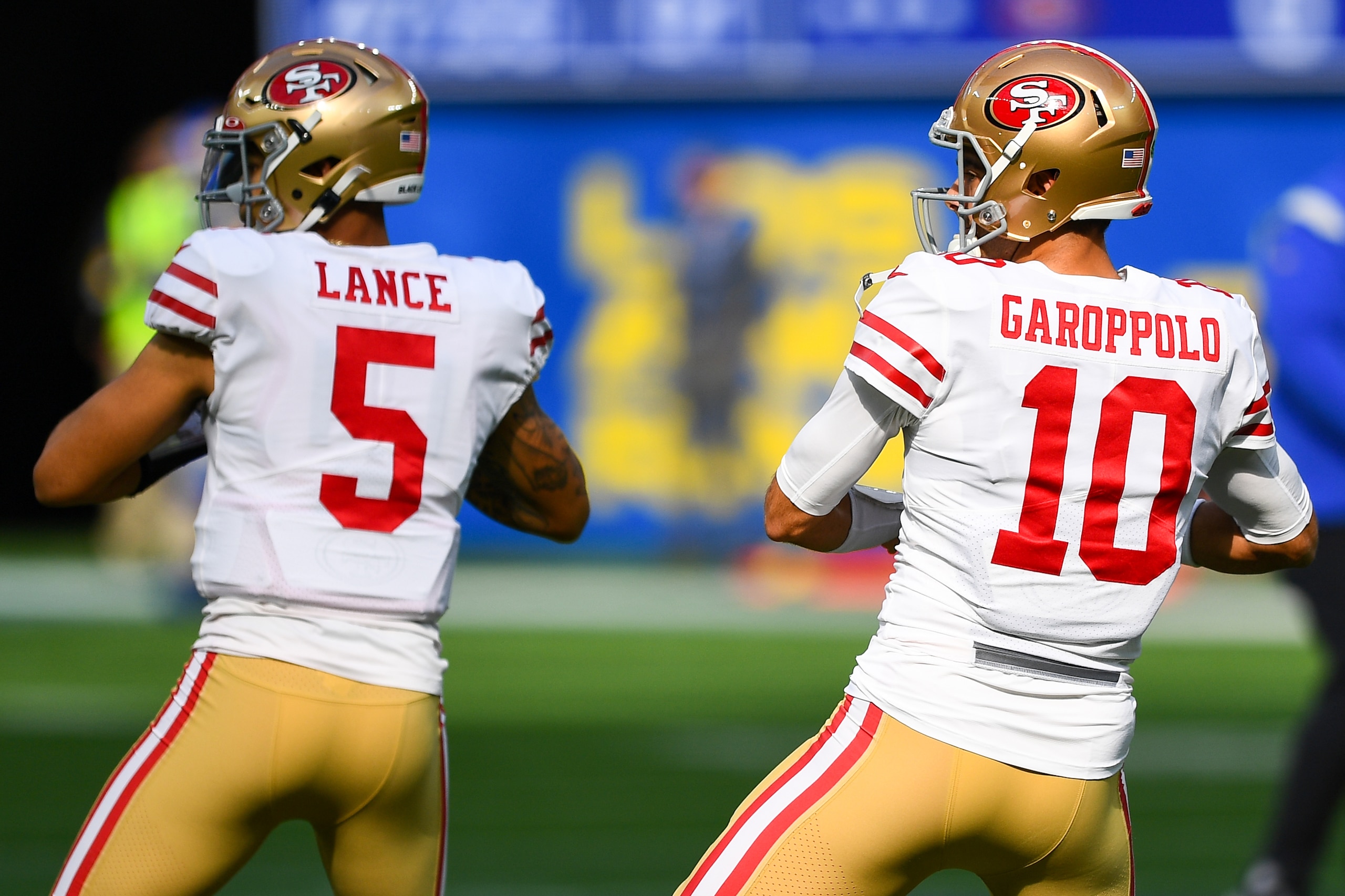 INGLEWOOD, CA - JANUARY 09: San Francisco 49ers Quarterback Trey Lance (5) and San Francisco 49ers Quarterback Jimmy Garoppolo (10) warm up before the NFL game between the San Francisco 49ers and the Los Angeles Rams on January 9, 2022, at SoFi Stadium in Inglewood, CA. (Photo by Brian Rothmuller/Icon Sportswire via Getty Images)
